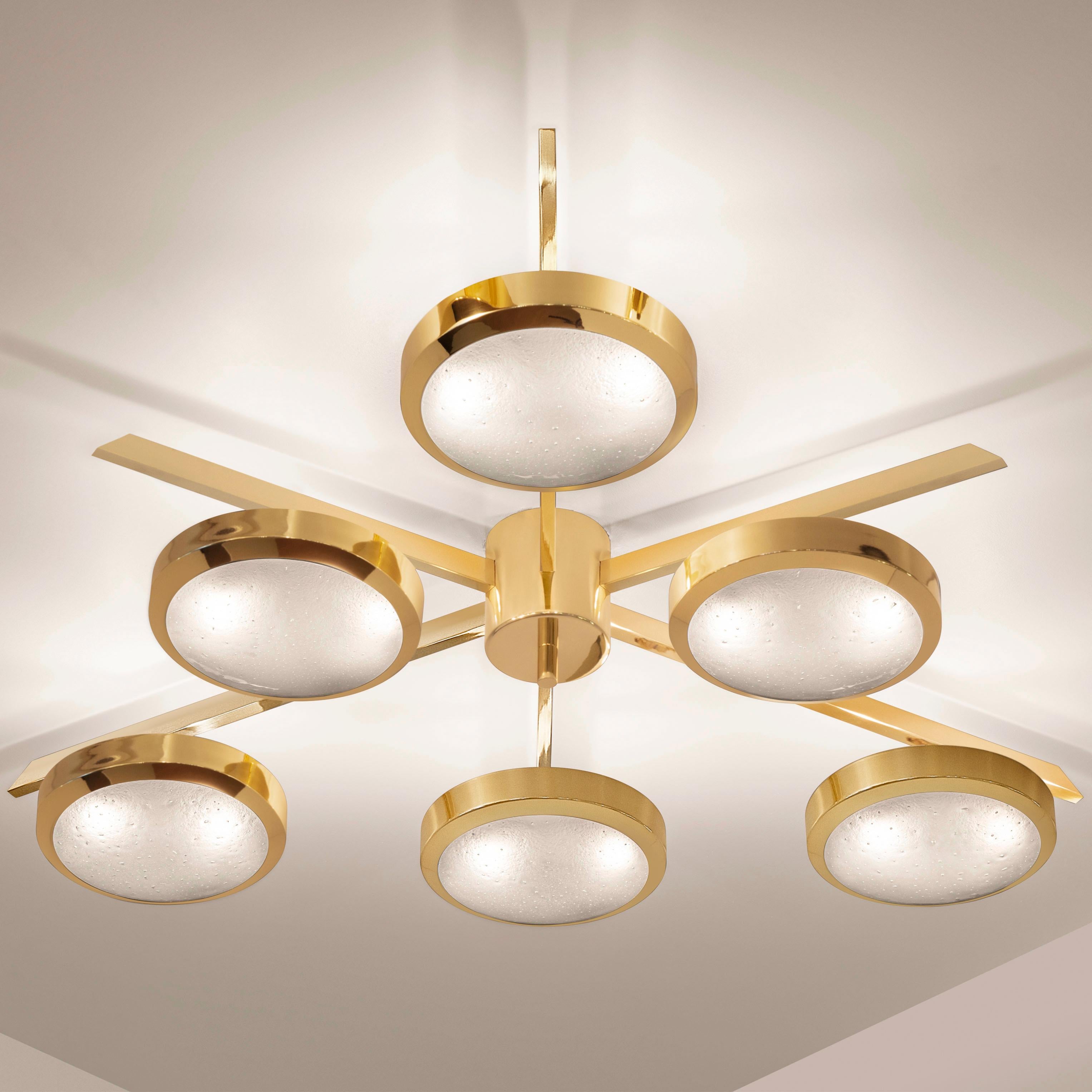 The Sei ceiling light is characterized by its star shaped frame with six suspended Murano glass shades. The first images show the fixture in our polished brass finish-subsequent pictures show it in a selection of alternative finishes. Starts at