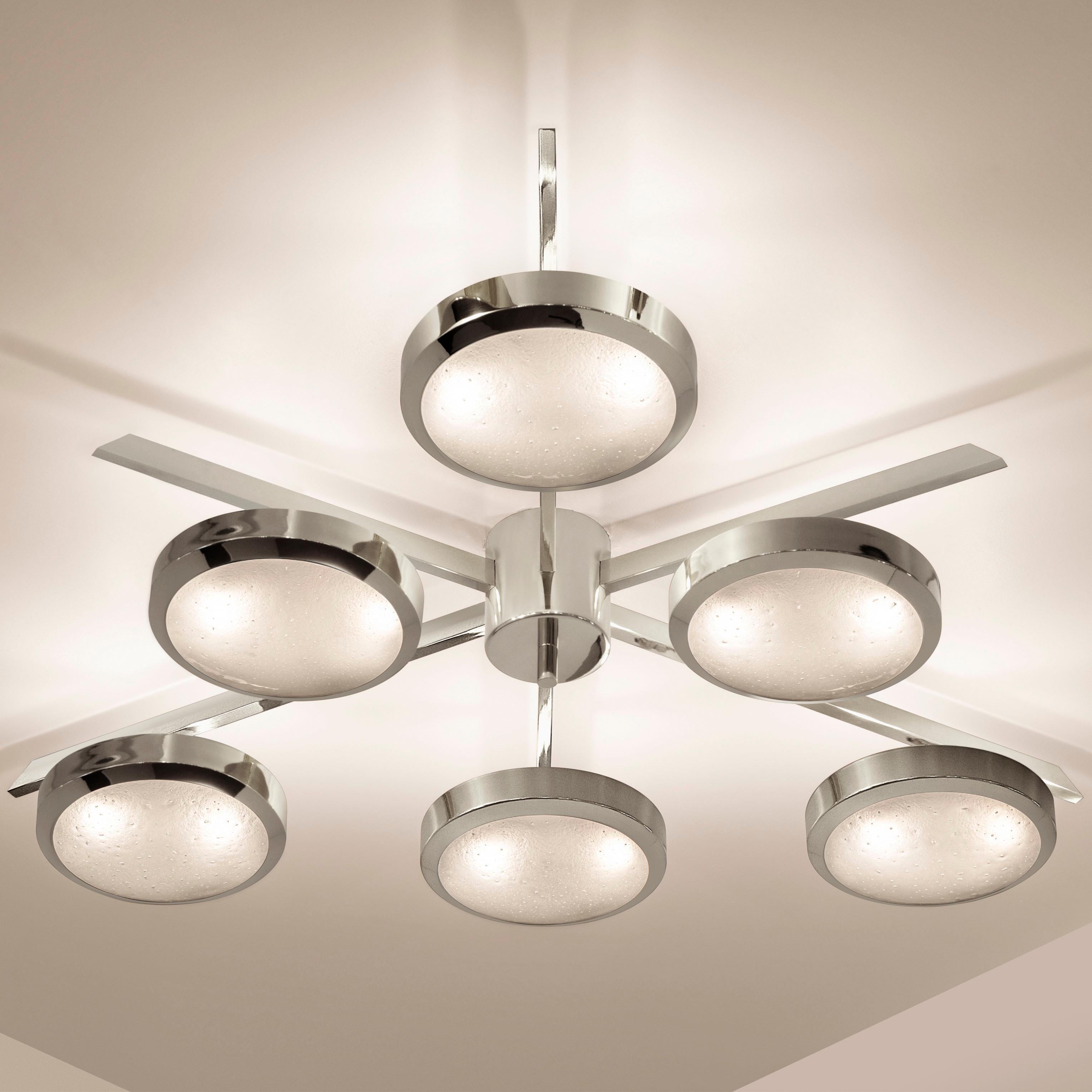 The Sei ceiling light is characterized by its star shaped frame with six suspended Murano glass shades. The first images show the fixture in our polished nickel finish-subsequent pictures show it in a selection of alternative finishes. Starts at