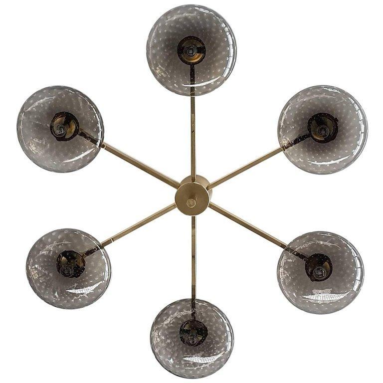 Italian flush mount with Murano glass shades mounted on solid brass frame / Designed by Fabio Bergomi / Made in Italy
6 lights / E12 or E14 type / max 40W each
Diameter: 51 inches / Height: 8 inches
Order only / This item ships from Italy
Order