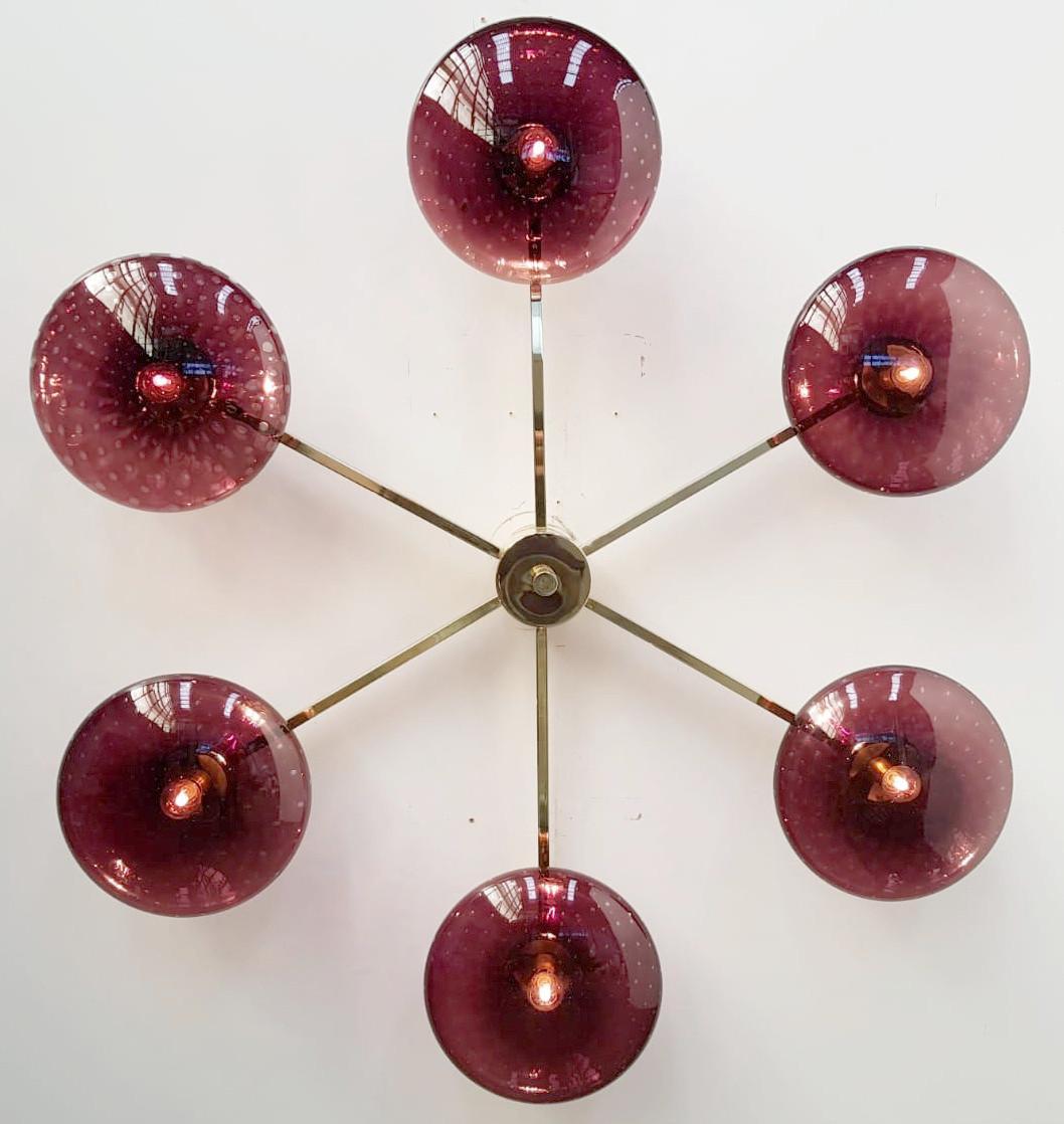 Italian flush mount with Murano glass shades mounted on solid brass frame / Designed by Fabio Bergomi / Made in Italy
6 lights / E12 or E14 type / max 40W each
Diameter: 51 inches / Height: 8 inches
Order only / This item ships from Italy
Order