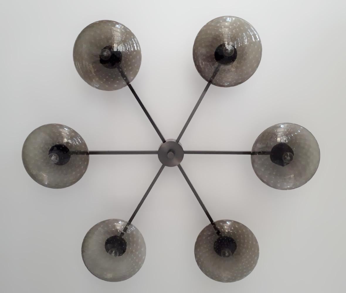 Italian flush mount with Murano glass shades mounted on solid brass frame / Designed by Fabio Bergomi / Made in Italy
6 lights / E12 or E14 type / max 40W each
Diameter: 51 inches / Height: 8 inches
Order only / This item ships from Italy
Order