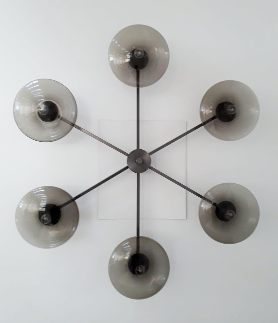 Italian flush mount with Murano glass shades mounted on solid brass frame / Designed by Fabio Bergomi / Made in Italy
6 lights / E12 or E14 type / max 40W each
Diameter: 51 inches / Height: 8 inches
Order only / This item ships from Italy
Order