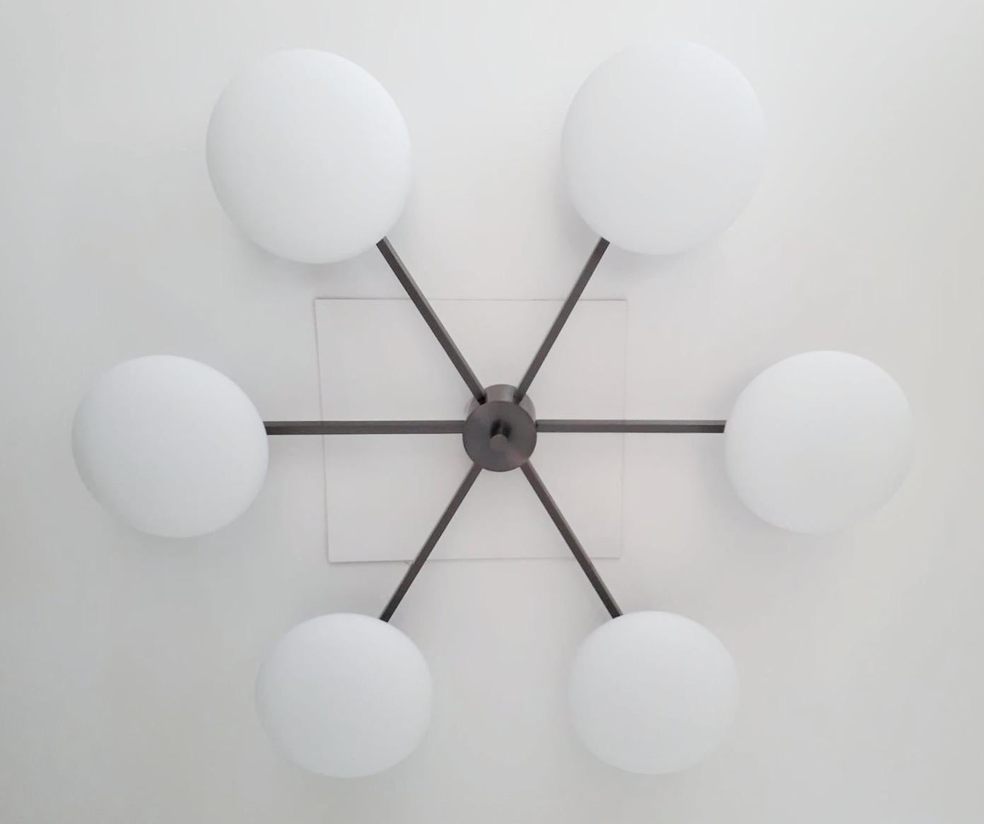 Italian flush mount with Murano glass shades mounted on solid brass frame / Designed by Fabio Bergomi / Made in Italy
6 lights / E12 or E14 type / max 40W each
Diameter: 51 inches / Height: 8 inches
Order only / This item ships from Italy
Order