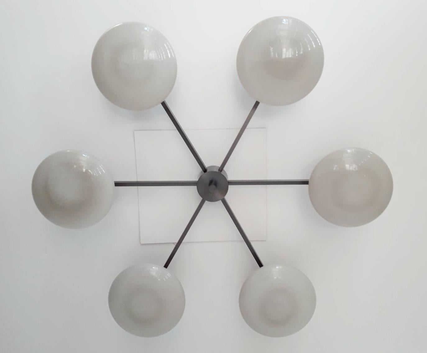 Italian flush mount with Murano glass shades mounted on solid brass frame / Designed by Fabio Bergomi / Made in Italy
6 lights / E12 or E14 type / max 40W each
Diameter: 51 inches / Height: 8 inches
Order only / This item ships from Italy
Order