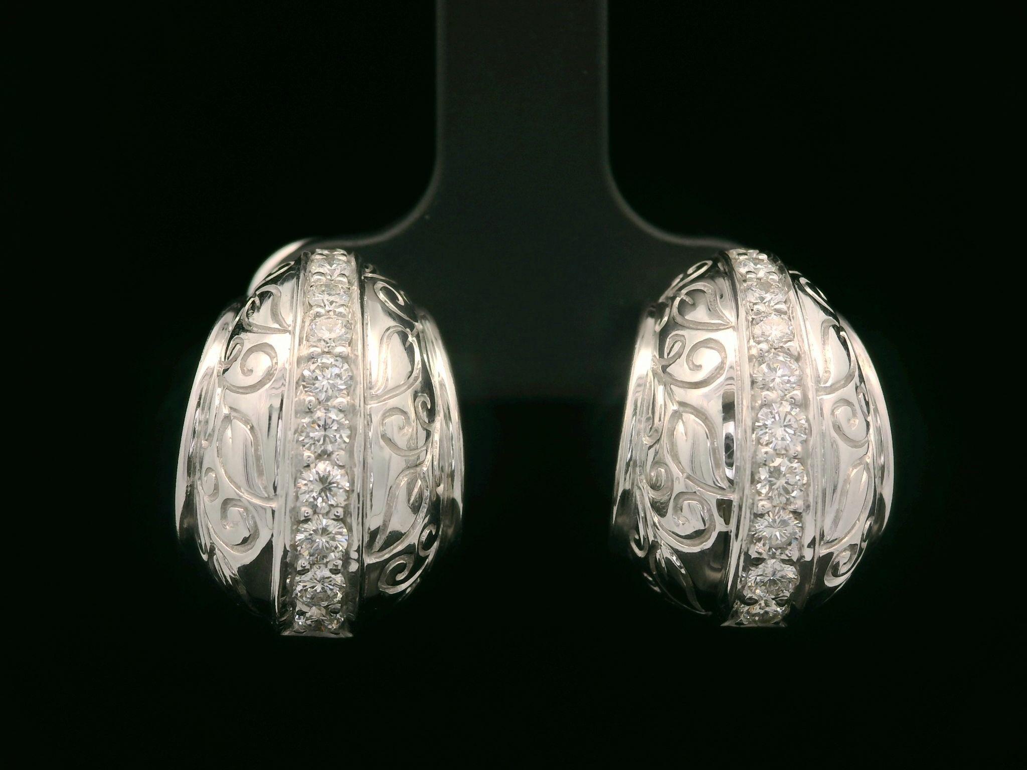 –Stone(s)–
(22) Natural Genuine Diamonds - Round Brilliant Cut - Pave Set - F/G Color - VS1/VS2 Clarity - 0.40ctw (approx.)

Material: Solid 18k White Gold 
Weight: 10.19 Grams
Closure: Posts w/ Omega Backs (Pierced ears are required.)
Overall