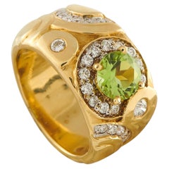 Anello SeidenGang in oro giallo 18 carati con diamante da 0,60 carati e peridoto SG05-062526