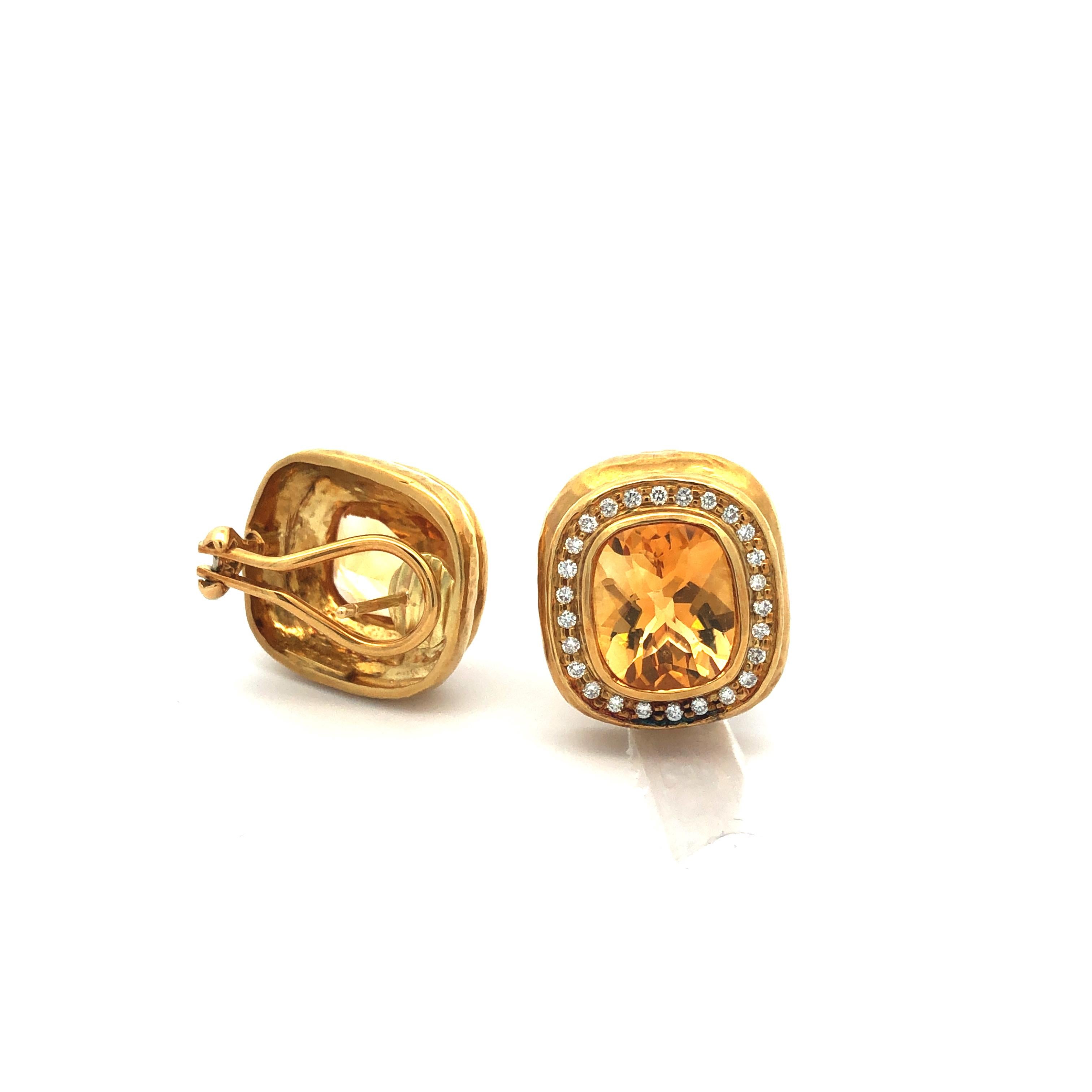 Elevate your style with these mesmerizing 18K yellow gold Seidengang earrings, featuring a stunning combination of citrine and diamonds.

At the center of each earring, a magnificent faceted cushion-cut citrine takes center stage, radiating warmth