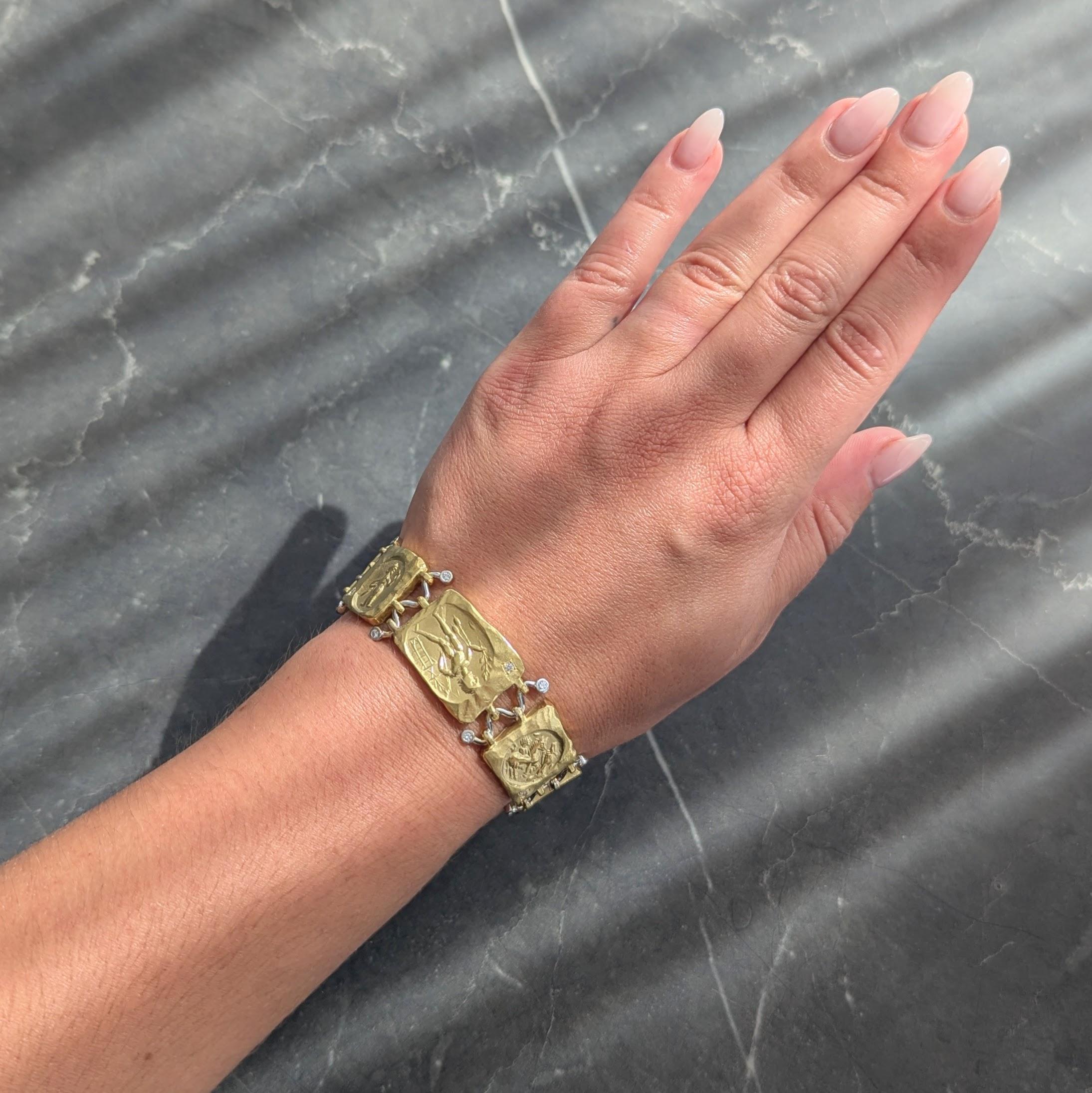 Comprised of hinged rectangular panel links centering ancient-style reliefs
Depicting various figures including a lion, a bull, horse, and goats
Designed with organic edges and texture with high polish accents
Connected by squiggle motif white gold