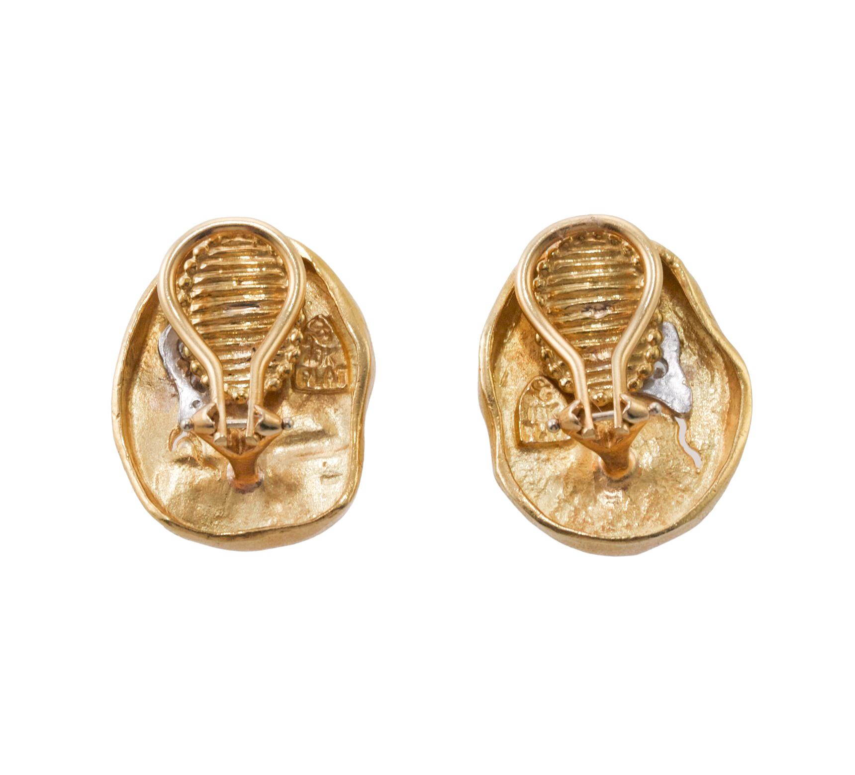 Pair of 18K gold and platinum Athena collection earrings by Seidengang, set with approx. ).14ctw in VS/G diamonds. Earrings measure 23mm x 18mm. Marked: SG mark, Plat, 18k. Weight is 17 grams. 