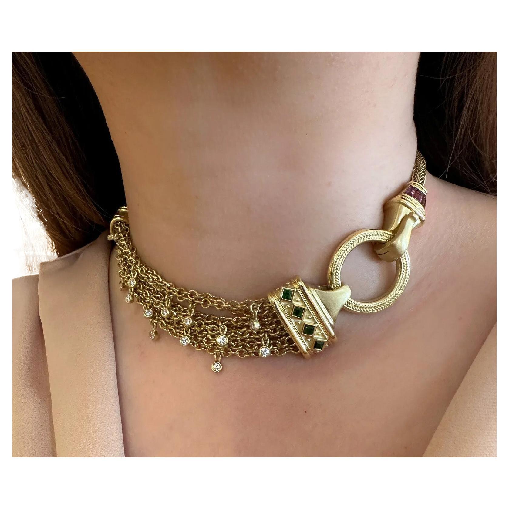 SeidenGang Choker Necklace with Diamonds and Tourmalines in 18k Yellow Gold

Multistrand Choker Necklace by SeidenGang features 8 Strands of Open Link Chain with 13 Bezel Set Diamonds accented by Pink and Green Tourmaline set in 18k Yellow Gold. The