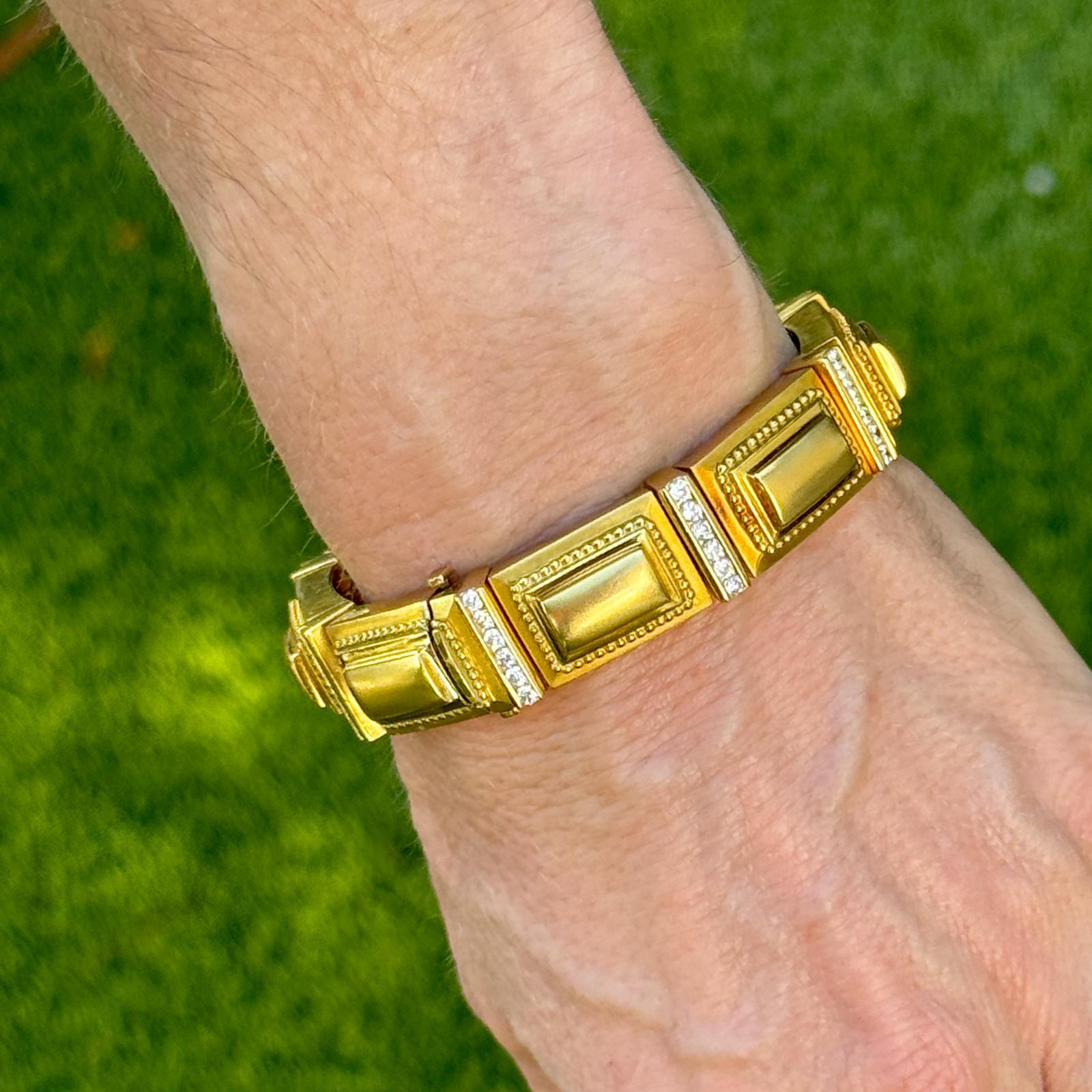 This SeidenGang Diamond Link Bracelet is an exquisite piece crafted in 18 karat yellow gold. The bracelet features a series of meticulously crafted rectangular links, each showcasing intricate detailing inspired by Etruscan design. Interspersed