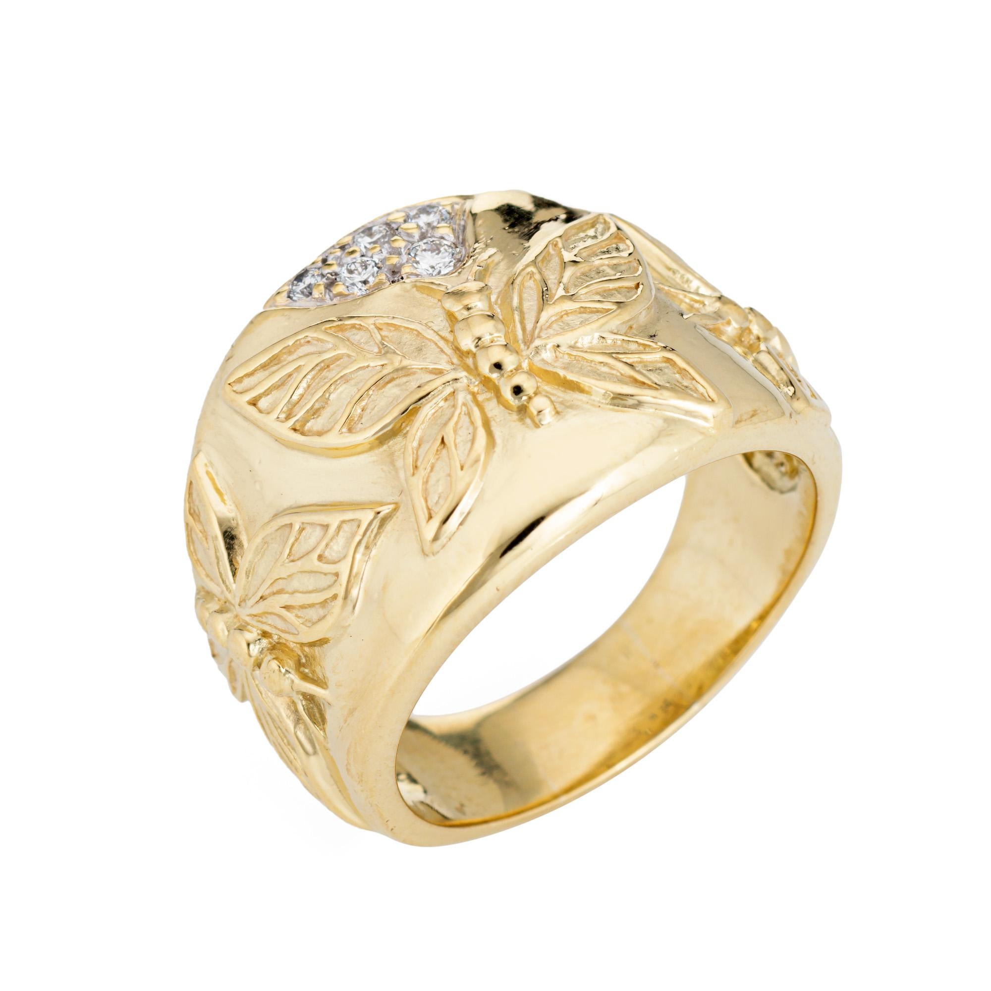 Stylish estate SeidenGang diamond butterfly ring crafted in 18 karat yellow gold. 

Diamonds total an estimated 0.06 carats (estimated at H-I color and VS2-SI1). 

The wide band features applied butterfly motifs with a cluster of diamonds to the