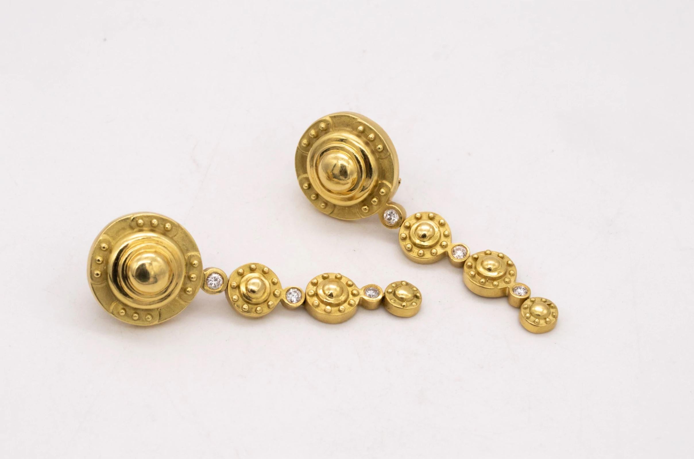 Elegant drop pair of earrings designed by Seidengang.

A vintage early pair, made by the jewelry designer's SeidenGang. These drop earrings are part of the Etruscan revival collection, carefully crafted in solid rich yellow gold of 18 karats, with