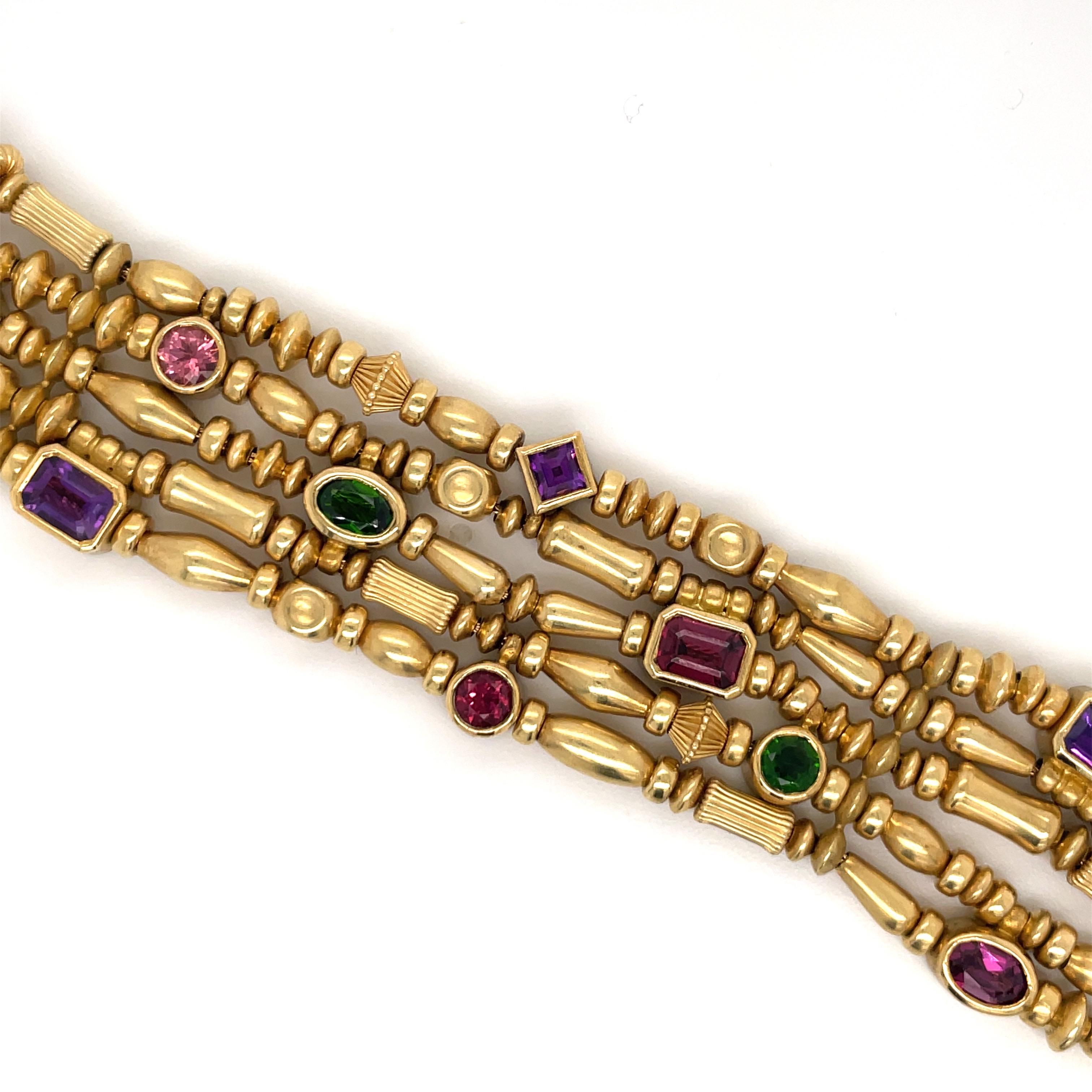SEIDENGANG five row beaded bracelet featuring multi color gemstones of emerald, garnet, amethyst and Tourmaline stones crafted in 18K yellow gold, 71.8 Grams.
Stamped SG 750