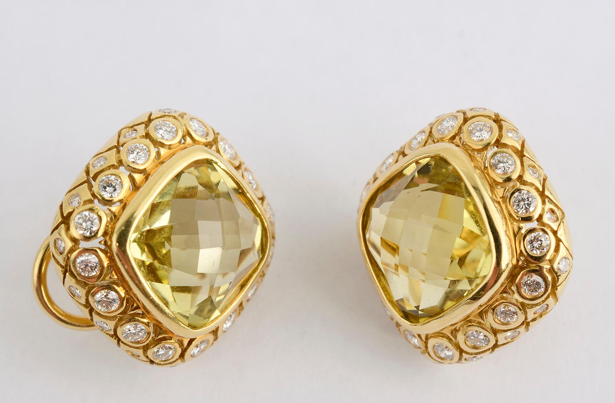 Seidengang earrings with a lemon/lime colored faceted quartz surrounded by diamonds. The two rows of diamonds in each earring weigh approximately 2.75 carats.
Backs are clips and posts. The earrings are 3/4 inch in length and width.