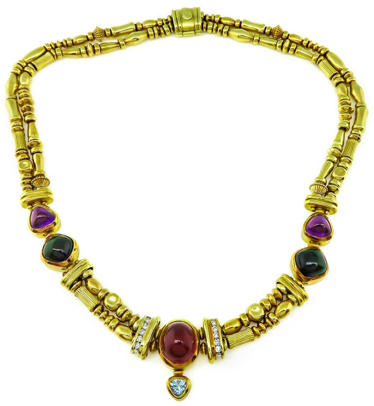 This charming 18k yellow gold necklace by SeidenGang features cabochon amethyst, pink tourmaline and green tourmaline. The necklace is also adorned by pear shape aquamarine and round cut diamond accents. 
It measures 15 inches in length and weighs