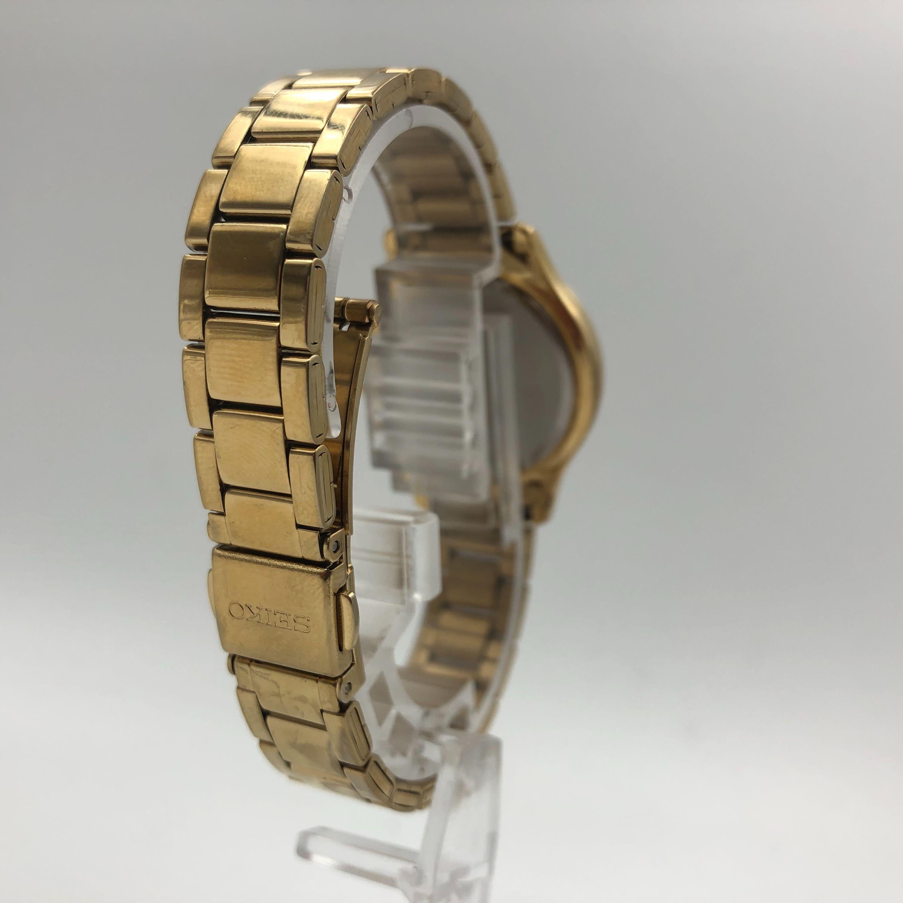 Seiko Dress Crystals Champagne Dial Gold Tone Steel Quartz Ladies Watch SXDF82 In Good Condition In New York, NY