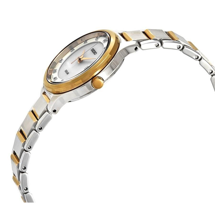 Pre-owned Seiko Solar 29mm Stainless Steel Two-Tone White MOP Dial Ladies Watch V137-0CN0. Damaged on the Crystal,  Micro Scratches and Nicks on the Gold-Tone Bezel And Bracelet, This Beautiful Timepiece Feature is Powered by a Quartz Movement and