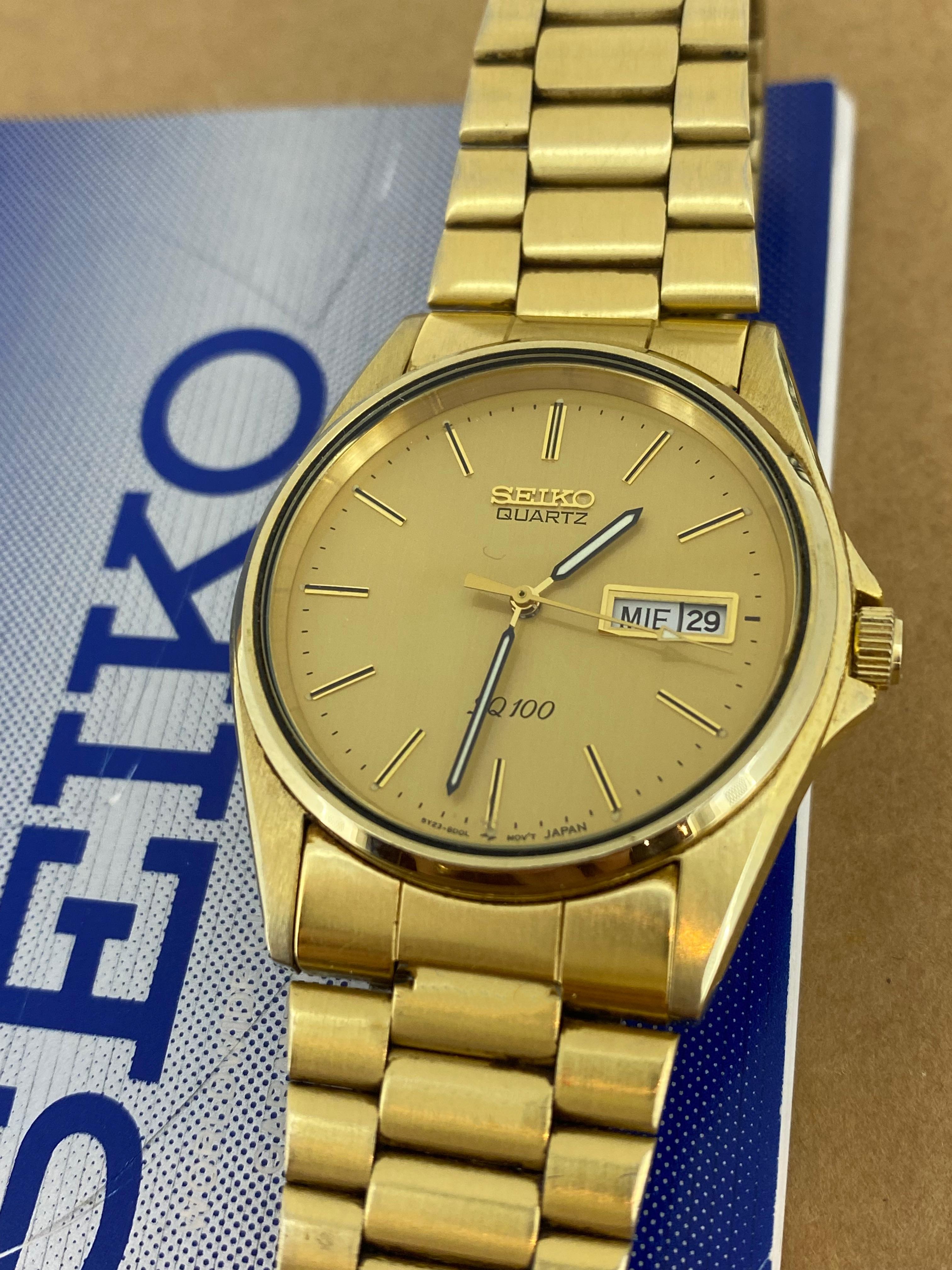 This vintage gents’ Seiko SQ100 is featuring:

a striking & desirable Champagne Dial, 
adorned with luminescent hands & baton numerals & 
day-date aperture at 3 o’clock

38mm Gold-Plated Stainless Steel Case
signed to the back & water resistant &