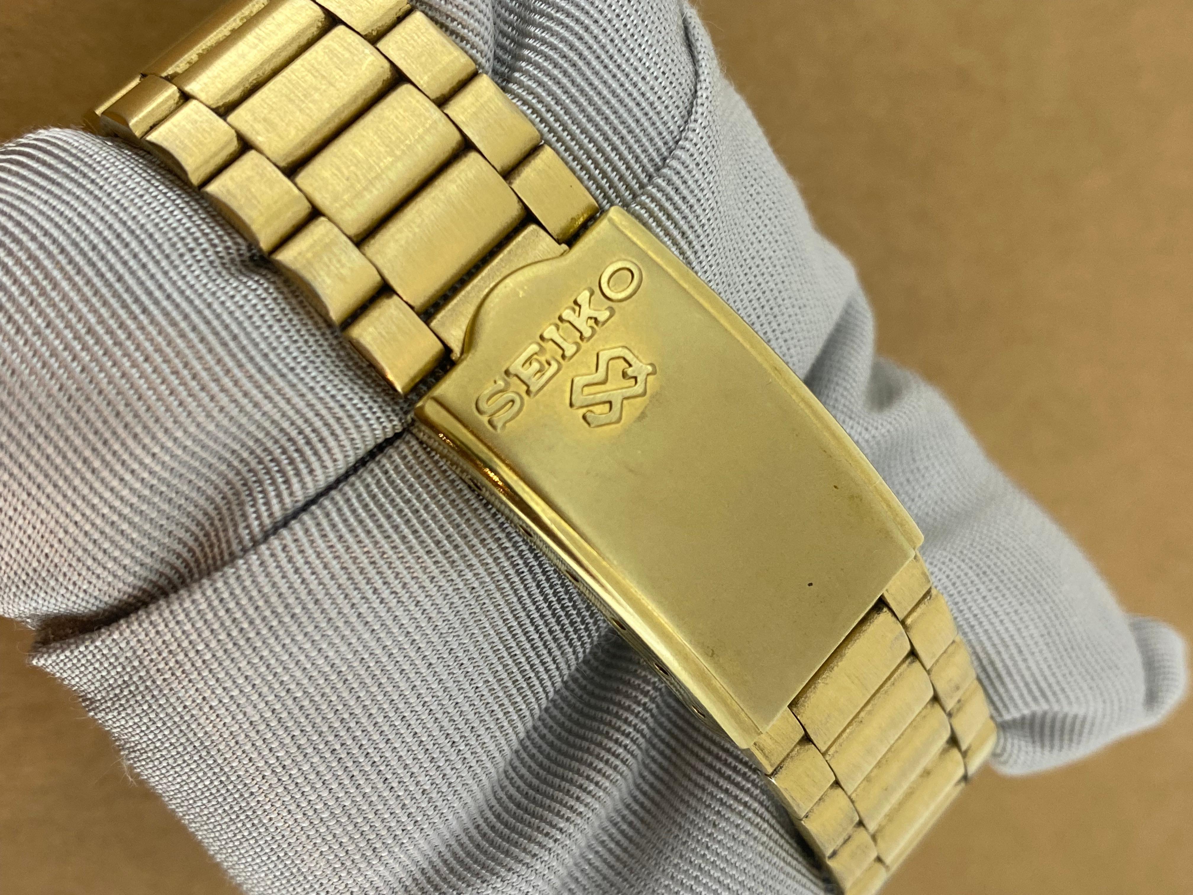 Seiko SQ100 Quartz Day-Date Champagne Dial Gold-Plated Watch. Box + Papers. Herren im Angebot