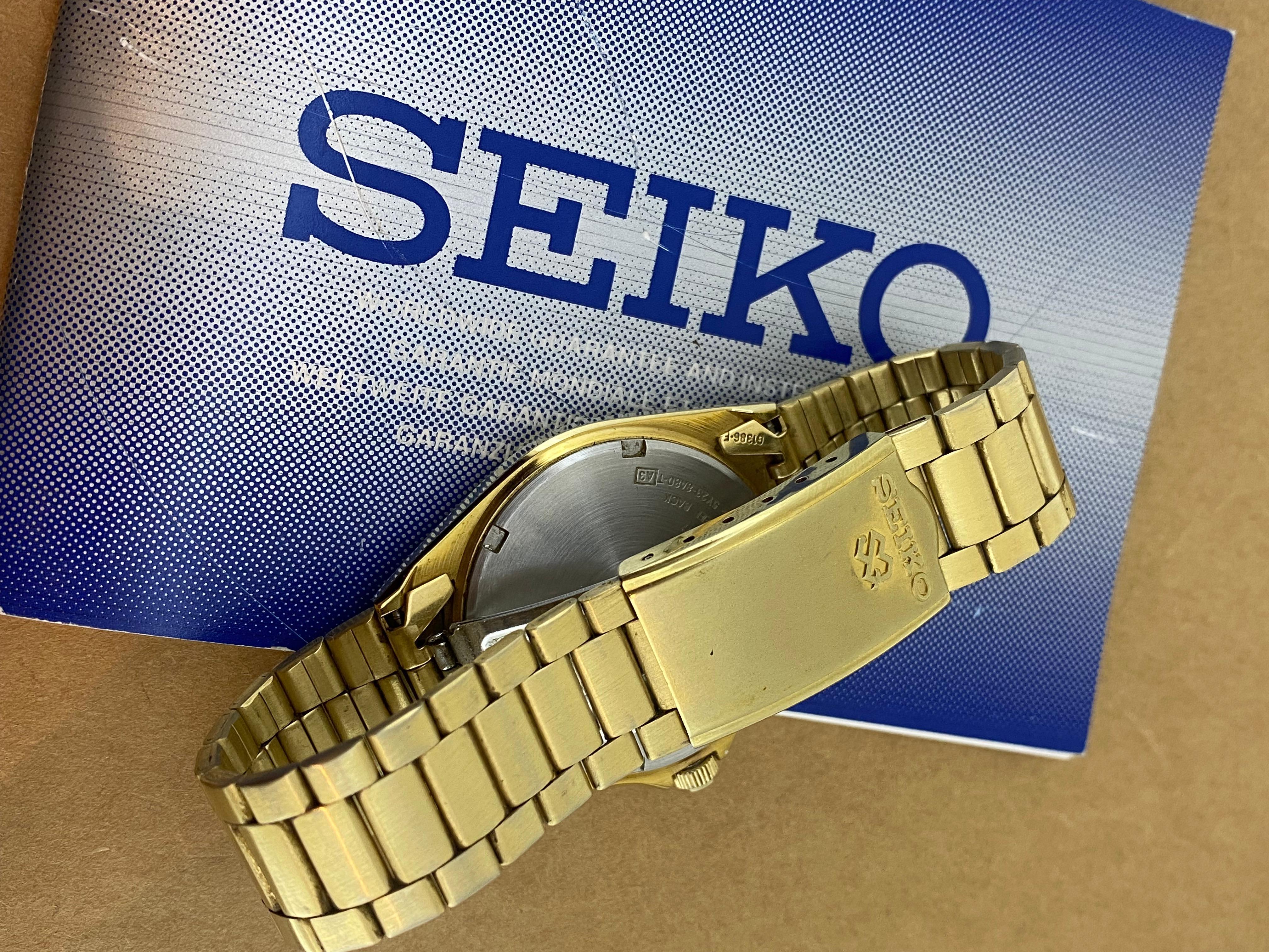 Seiko SQ100 Quartz Day-Date Champagne Dial Gold-Plated Watch. Box + Papers. im Angebot 1