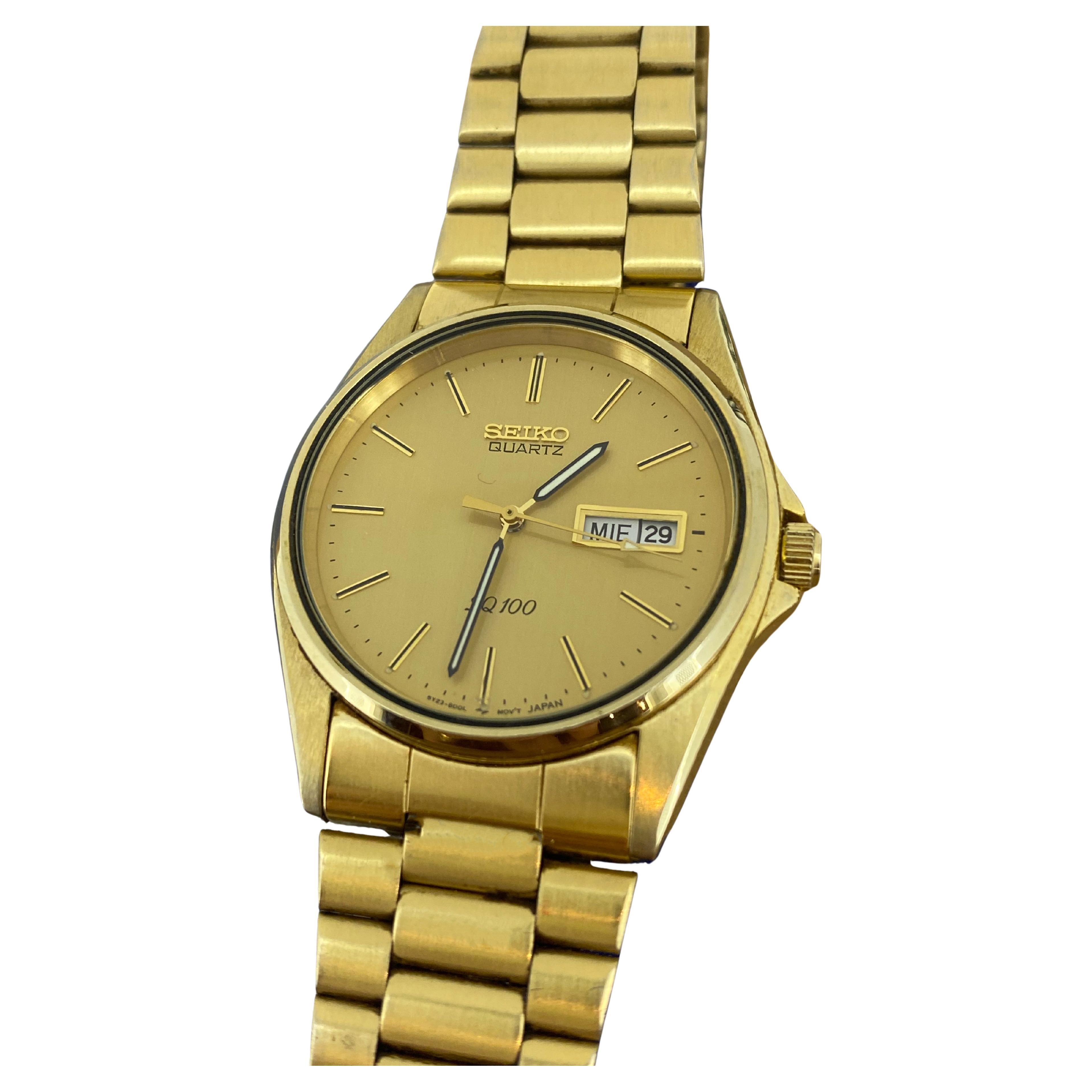 Seiko SQ100 Quartz Day-Date Champagne Dial Gold-Plated Watch. Box + Papers.