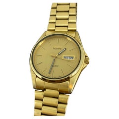 Seiko SQ100 Quartz Day-Date Champagne Dial Gold-Plated Watch. Box + Papers.