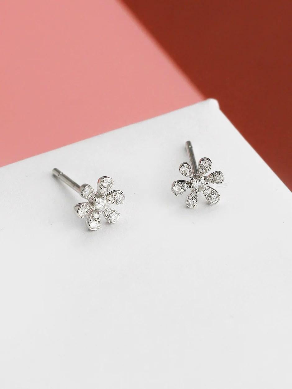 Micro pave white diamond classic flower earring, all with a high polish finish. Available in 18K White Gold.

Earring Information
Diamond Type : Natural Diamond
Metal : 18K
Metal Color : White Gold
Diamond Carat Weight : 0.23ttcw
Diamond Color