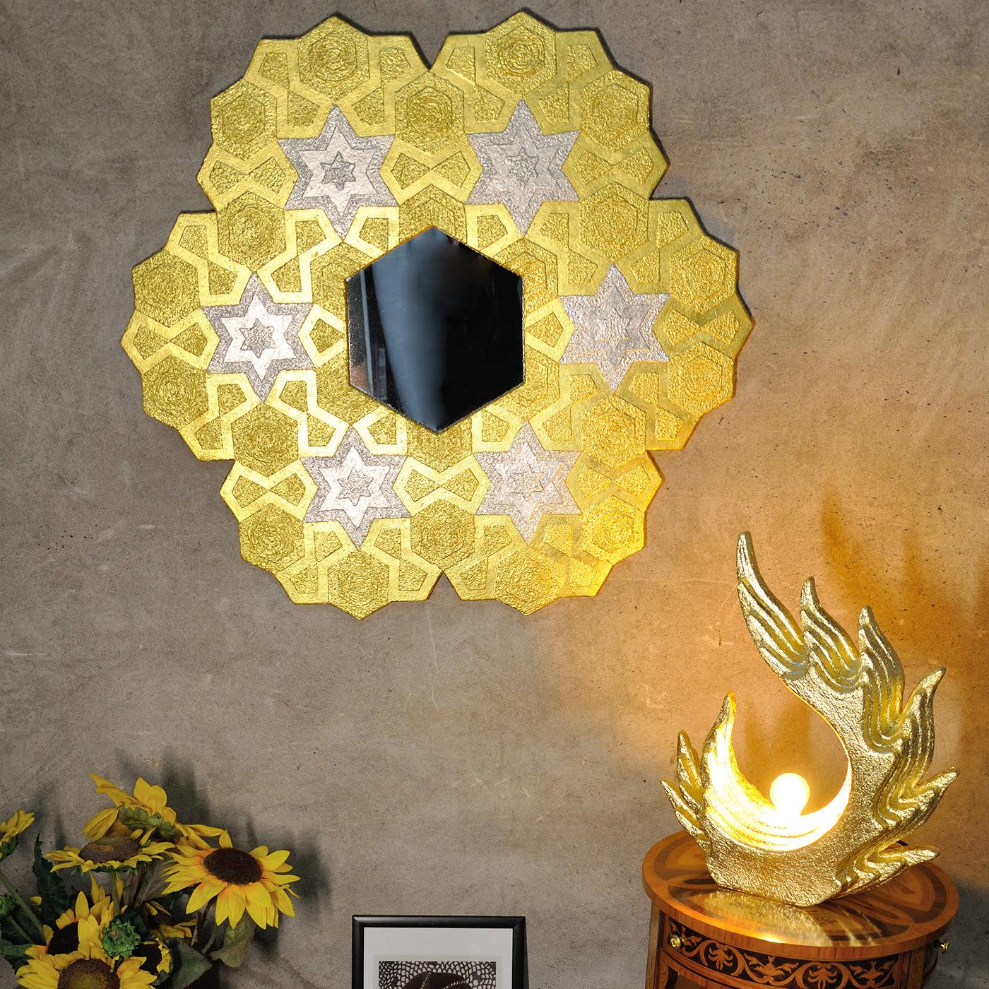 This hexagonal wall mirror is a remarkable feat of design and craftsmanship. Symmetrical, graphic decorative patterns of Arabesque inspiration combine and duplicate in a striking visual allure on the wooden frame enclosing the mirror in the center.