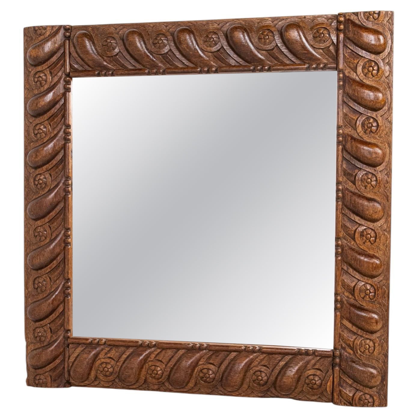 Seiz Breur style square mirror in carved wood, Brittany, France, early 20th