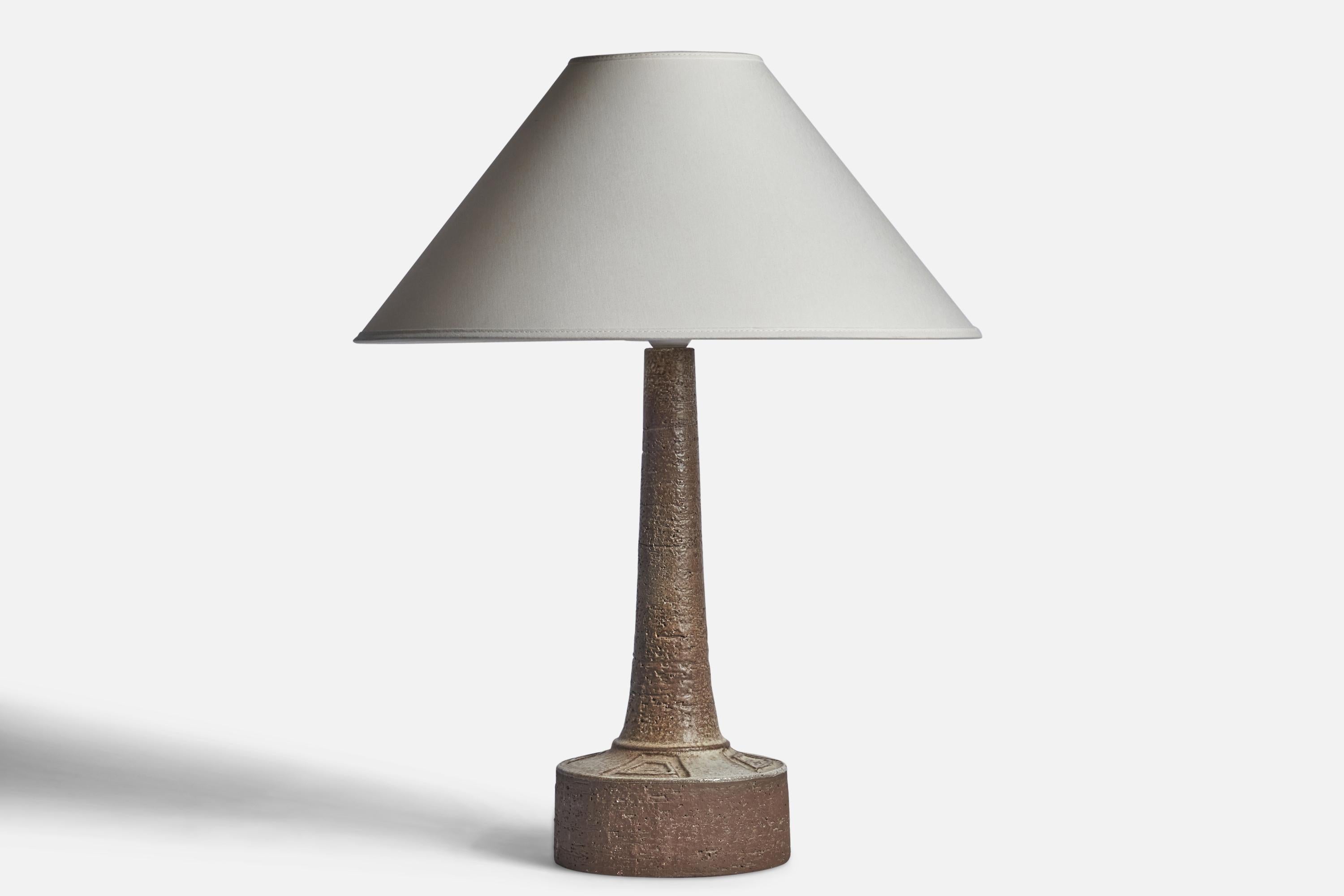 A brown and grey-glazed stoneware table lamp designed and produced by Sejer, Denmark, c. 1960s.

Dimensions of Lamp (inches): 16” H x 6.05” Diameter
Dimensions of Shade (inches): 4.5” Top Diameter x 16” Bottom Diameter x 7.25” H
Dimensions of Lamp