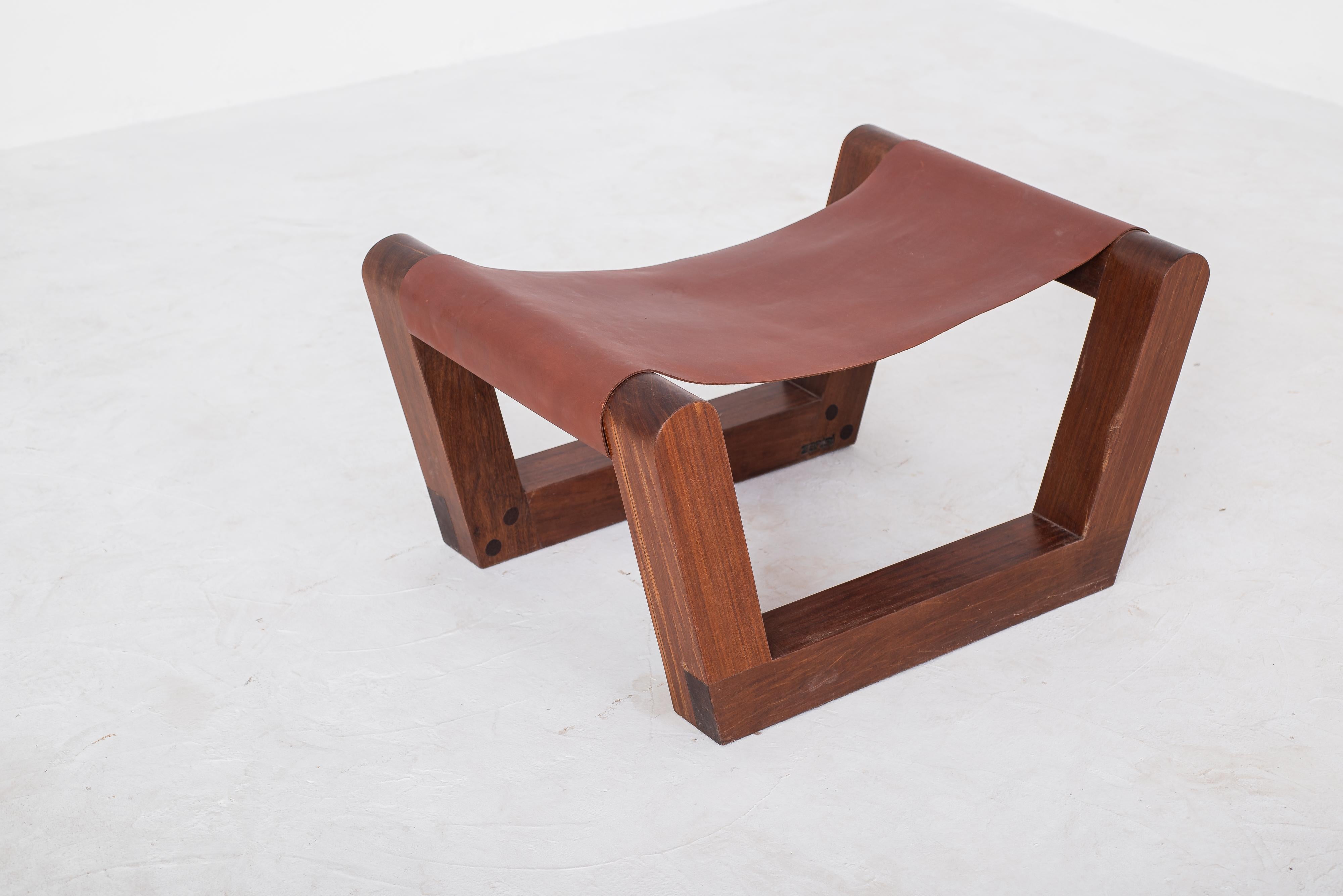 A limited-edition bench by Zanini de Zanine, crafted from reclaimed  wood and leather. 