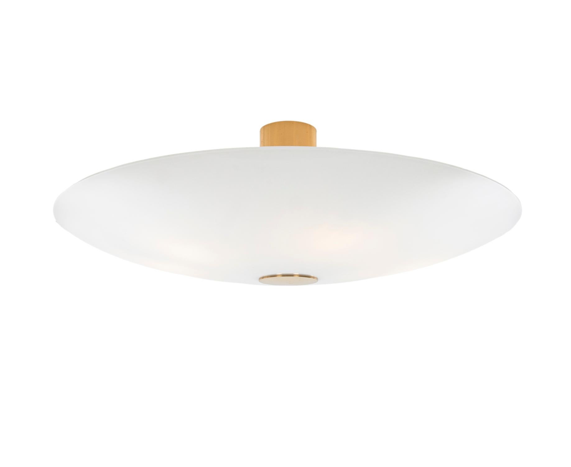 Elegant white opal glass and brass wall or ceiling flush mount light by Florian Schulz / Licht und Objekt made in Germany in the 1960s.

The lamp is well-constructed and of extremely high quality (made in Germany) and, despite series production, a