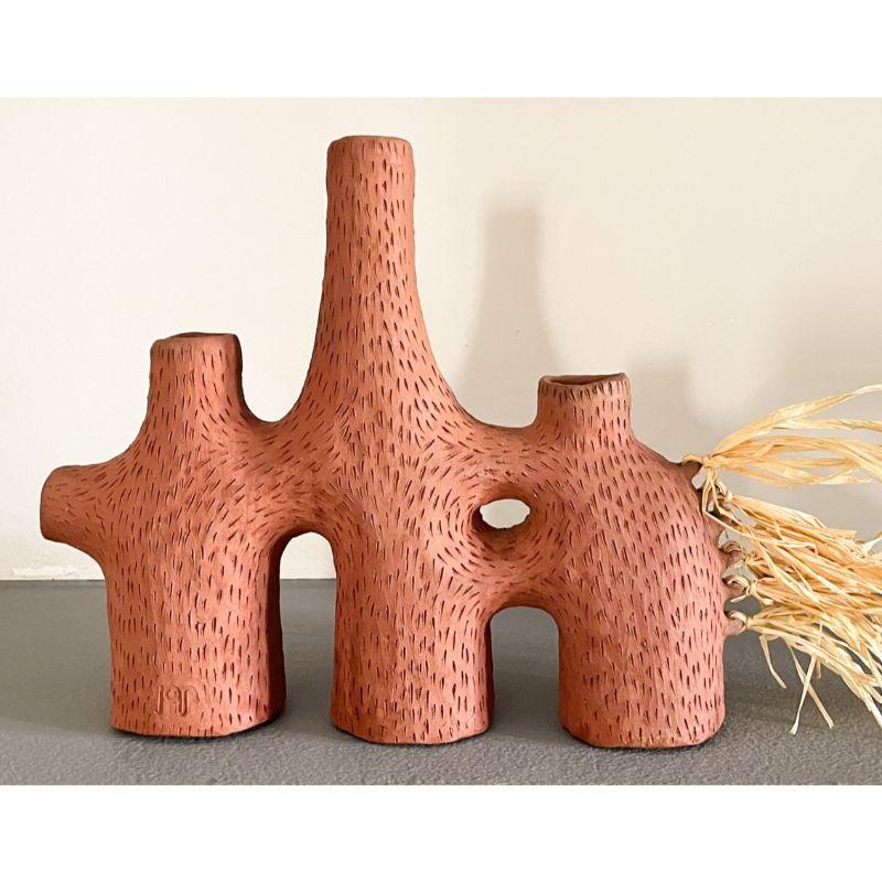 Selamawi ceramic candleabra by TheUrbanative
Dimensions: W 25 x D 10 x H 24 cm
Material: Raw Terracotta & Raffia
Dry flowers only.
Also available: Selamawi Ceramic Vessel.

TheUrbanative is a contemporary South African furniture and product