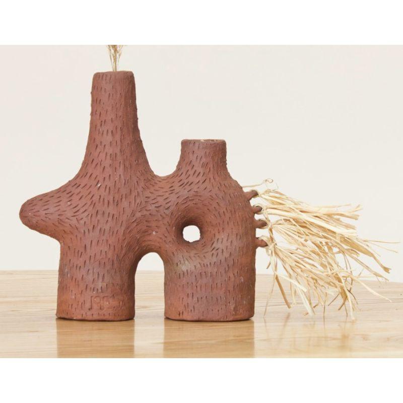 Selamawi ceramic vessel by TheUrbanative
Dimensions: W 25 x D 10 x H 24 cm
Material: Raw Terracotta & Raffia
Dry flowers only.

Also Available: Selamawi Ceramic Candelebra.

TheUrbanative is a contemporary South African furniture and product
