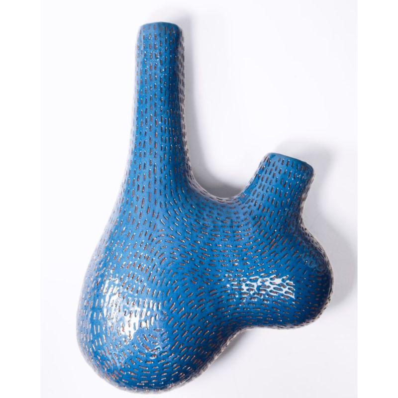 Selamawi wall vessel, blue by TheUrbanative
Dimensions: W18 x D10 x H25 cm
Material: Glazed terracotta wall hing vessel.
Vessel comes with steel plate wall hanging bracket.

Also available: different shapes of Selamawi ceramic vessels.
