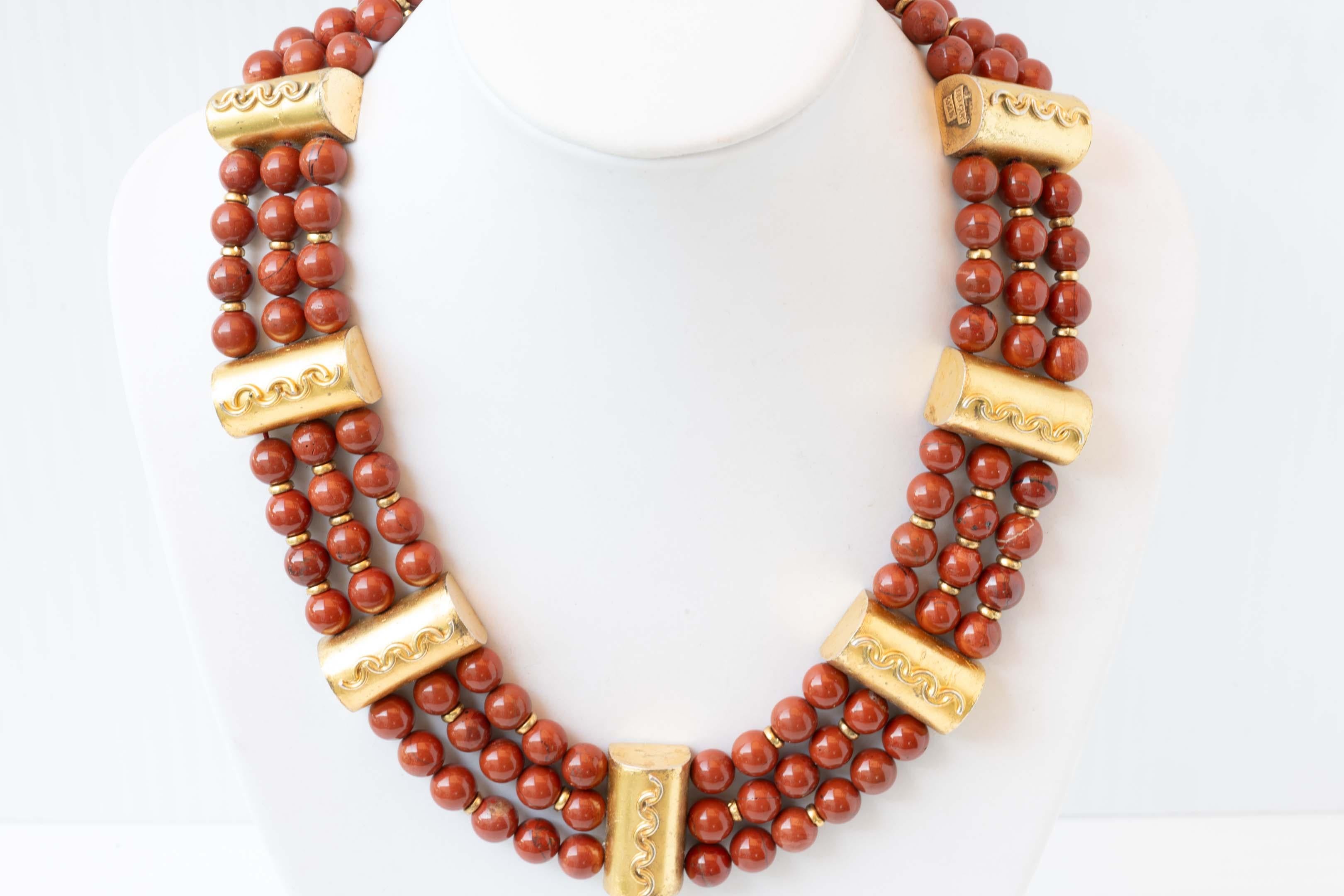 Gold plated sterling silver & triple strand carnelian bead necklace. Signed and marked Selcuk 925, made in late 1990. Measures 16 inches long, preowned and in good condition. 