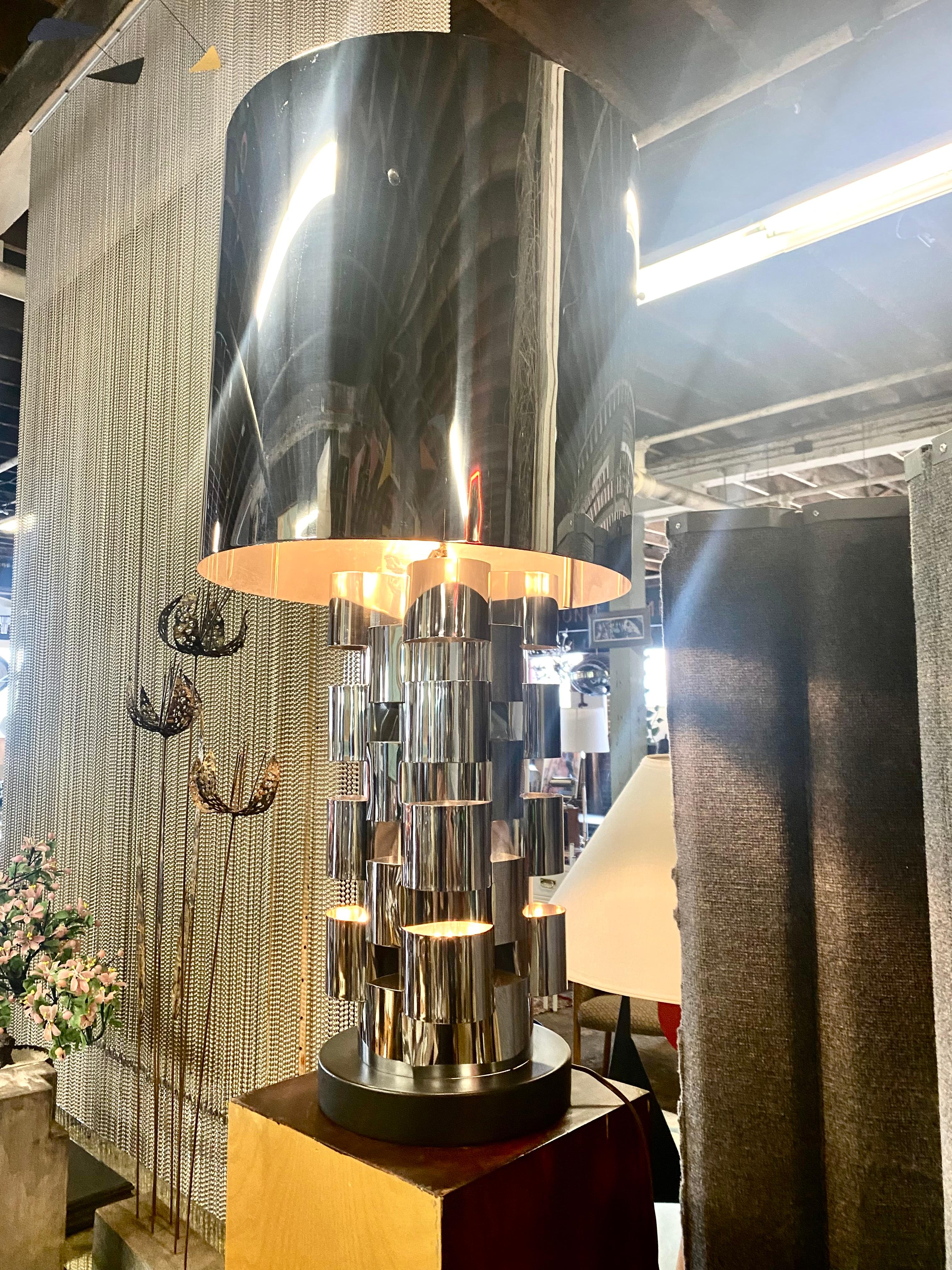A BRUTALIST table lamp by Curtis Jere with interlocking polished chrome construction and large drum shade, retains Curtis Jere signature. Really nice original condition. Very minor bend (dent) to bottom or shade, hardly noticable, not worth