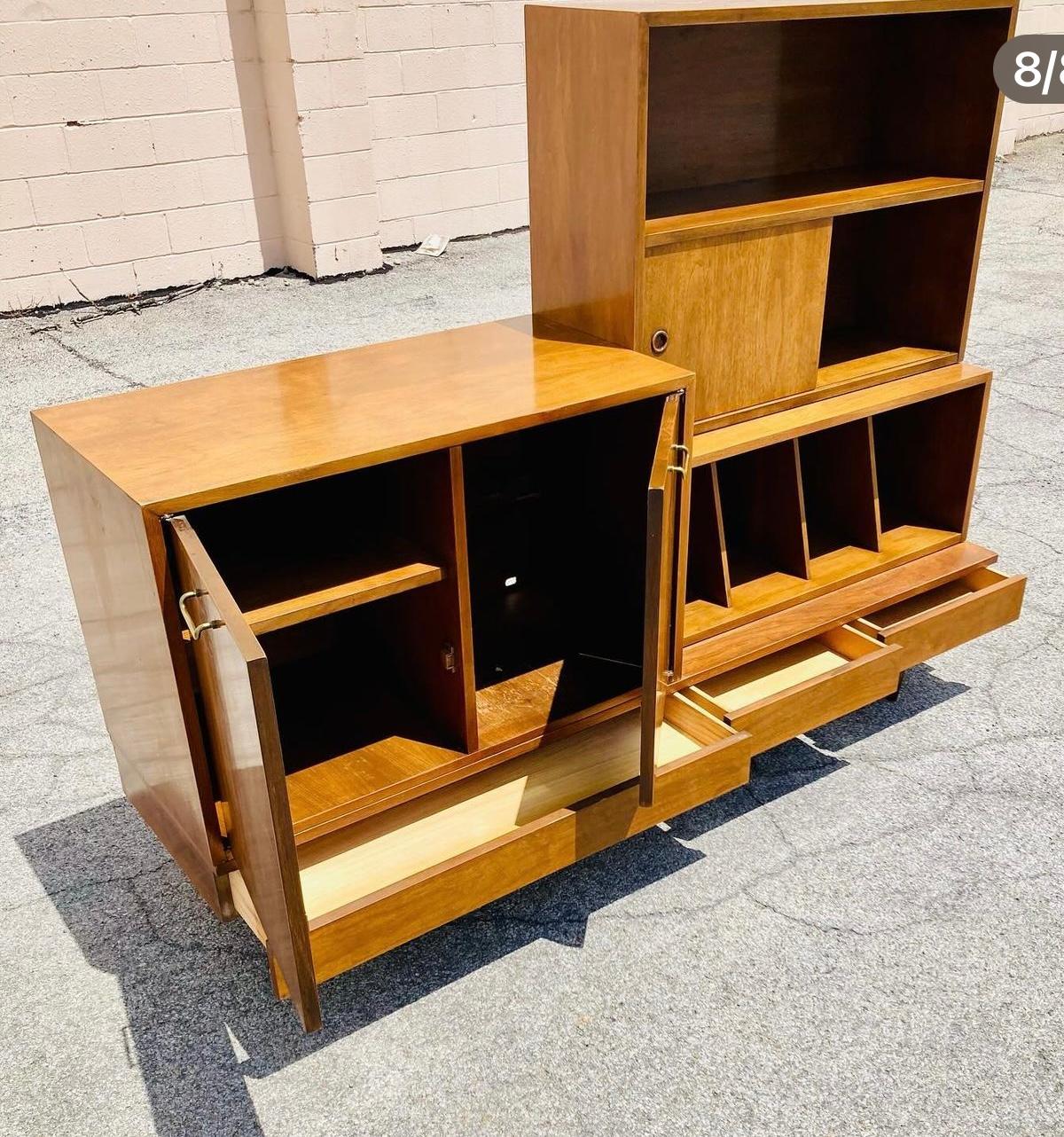 
Seldom seen modular Media ,storage cabinet designed by Merton Gershum for American Of Martinsville. Great design! Featuring 4 separate modular units. base with 3 drawers, brass detailing. (left top) cube cabinet, right side (bottom) record / album