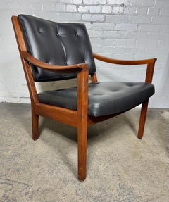 Seldom seen pair modernist walnut and leather lounge chairs made by Gunlocke