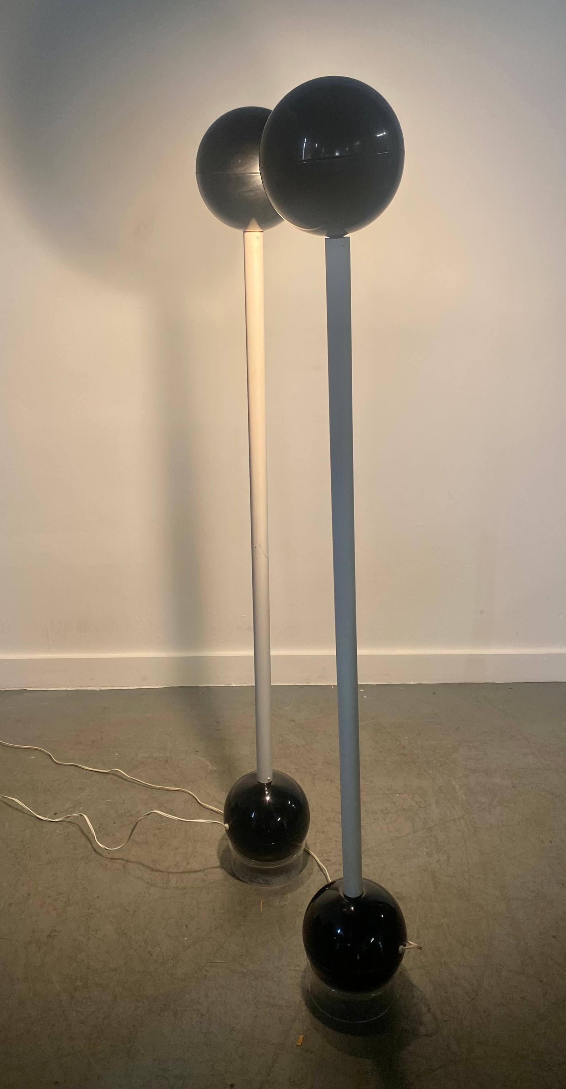 A vintage rare pair of barbell lamps designed circa 1960s by esteemed lighting designer John Mascheroni. Heavy steel bases allow lamps to balance in any direction desired. Retain original lucite ring bases.I have the lamps priced individually.Would