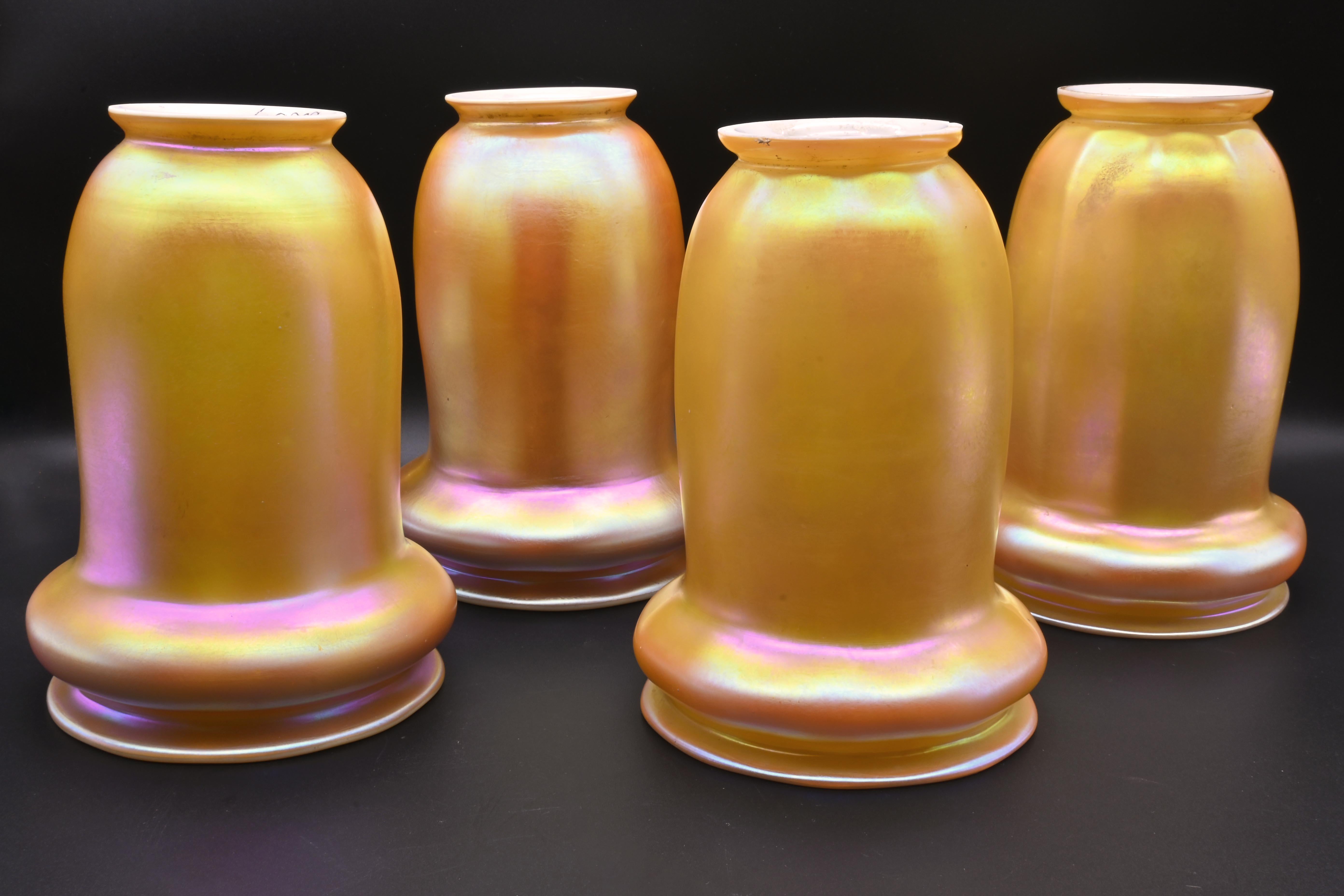 Seldom Seen Steuben Golden Arene & Calcite American Art glass shades

Four available
Sold individually

AA# S60028
Amazing Aurene outside with Calcite inside, giving the shades a subtle yellow/orange glow. The curve in the bottom part of the