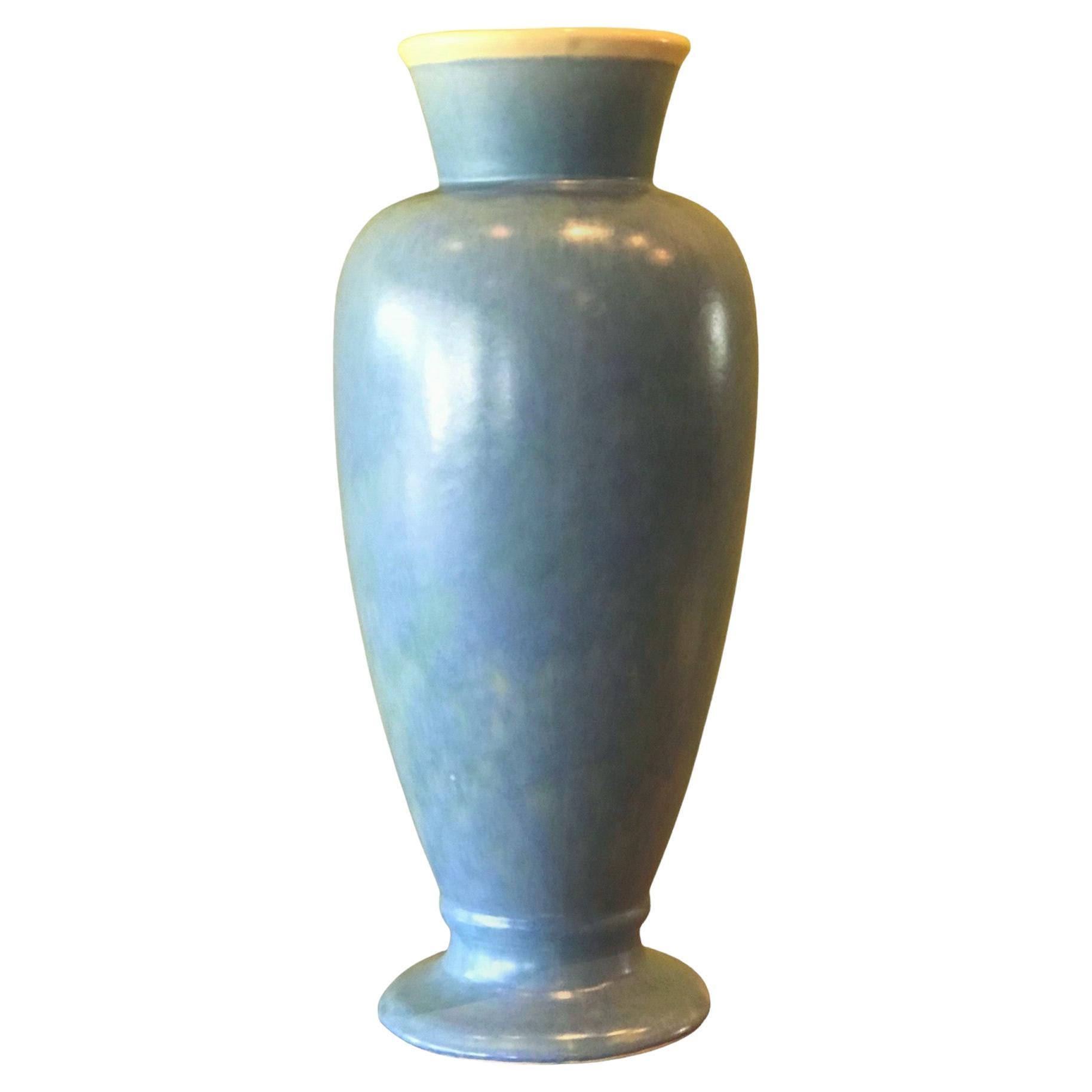 Large scale pottery vase by Weller Pottery from the 1920s with a seldom seen shape. In a Sky Blue color outside and a soft white interior. Signed with 1920s scripted Weller. In Very Good Condition.  Minor wear consistent with age and used with no