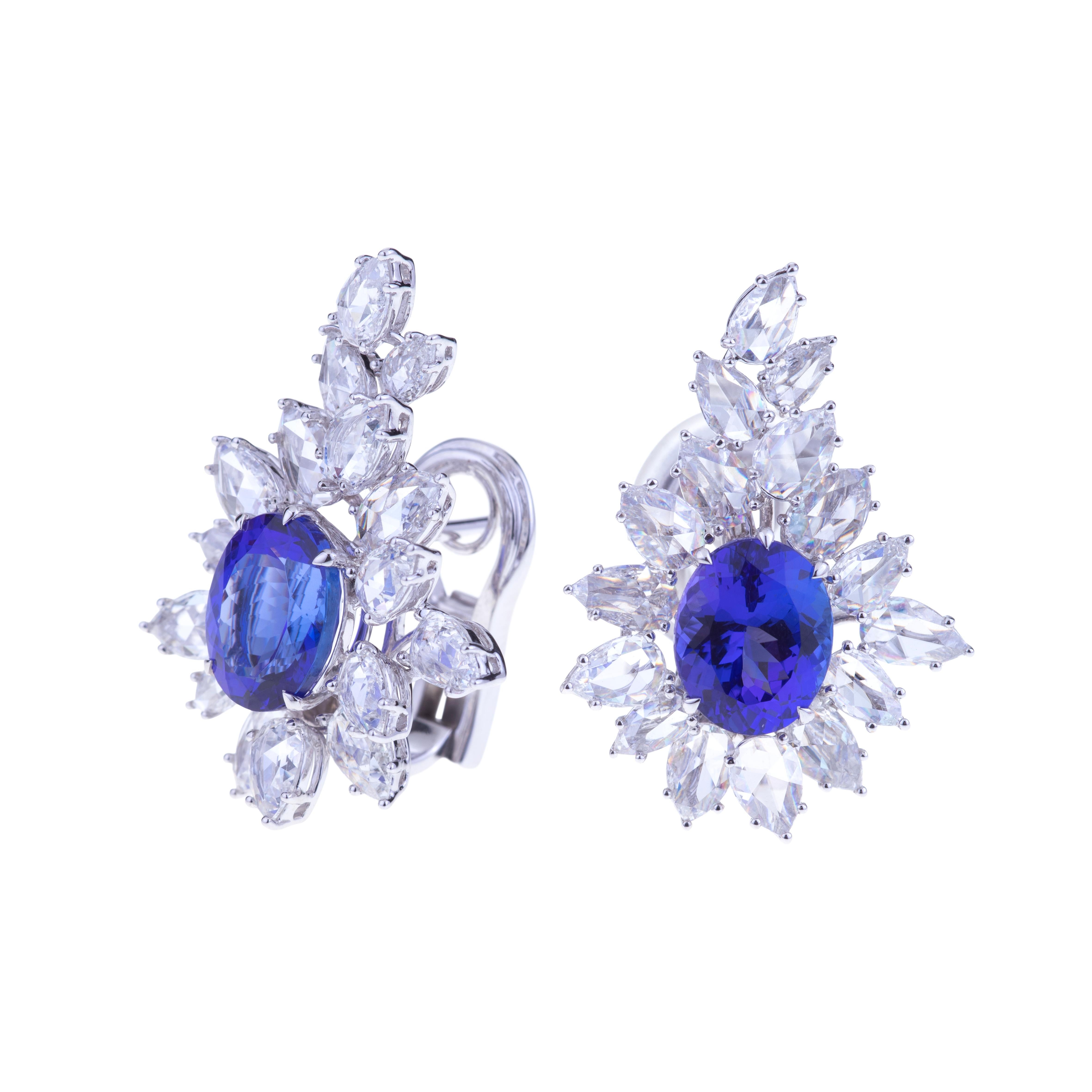 Selected Intense Blue Tanzanite Earrings Set in White Gold with Diamonds.
Unique Earrings White Gold with a Couple of Intense Blue Tanzanite ct. 7.58 Faceted Oval Cut mm. 10x8. Diamonds are All Around (ct. 5.33 VVS) which are sellected  with a
