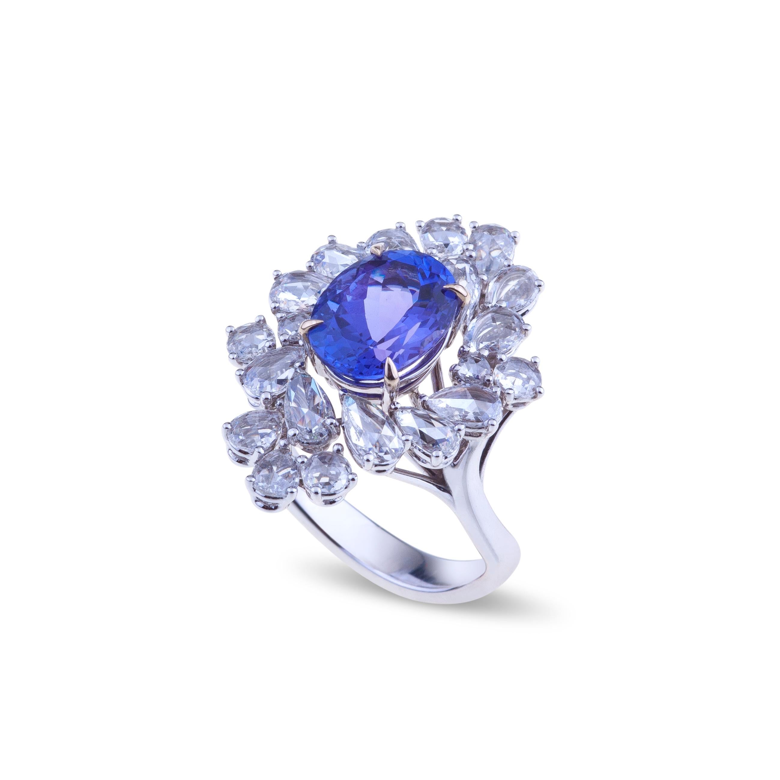 Selected intense blue tanzanite ring set in white gold with diamonds.
A unique white gold ring  with a selected intense blue tanzanite ct. 3.43 faceted oval cut and diamonds ct. 1.88 VVS which are a perfect mix of round and pears rose cut The weight