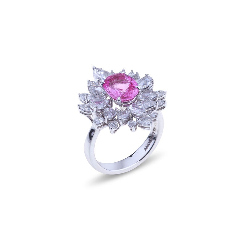 Selected pink sapphire ring set in white gold with diamonds.
A traditional ring  white gold with a selected bright pink sapphire ct. 2.46 oval cut and diamonds ct. 2.51 VVS which are a perfect mix of marquise and pears rose cut. The weight of the
