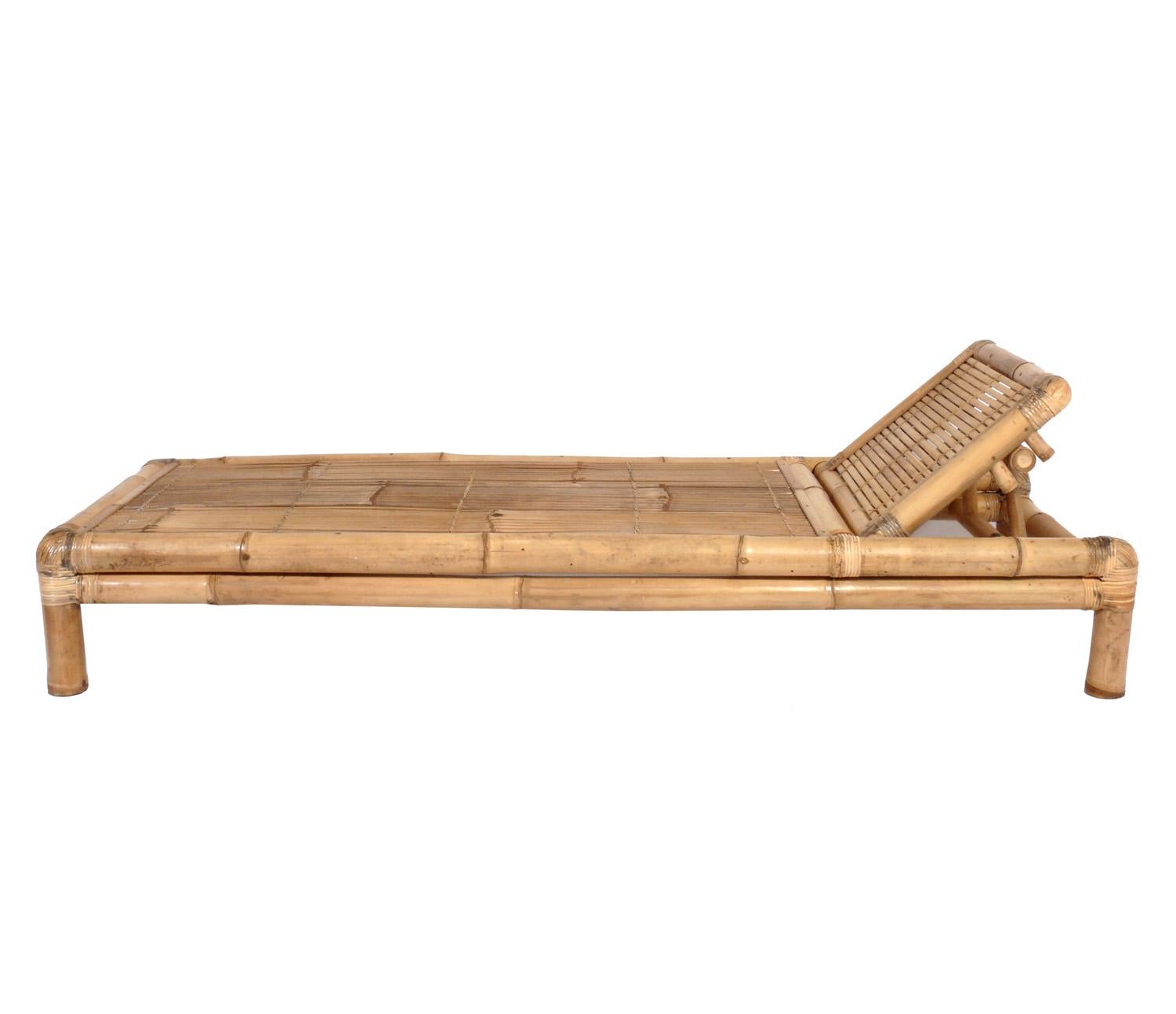 Selection of mid-century bamboo chaise longues, American, circa 1950s. They are priced at $1850 each or $3200 for the pair. They retain their warm original patina. Adjustable headrests still function well. If you would like cushions made for these,