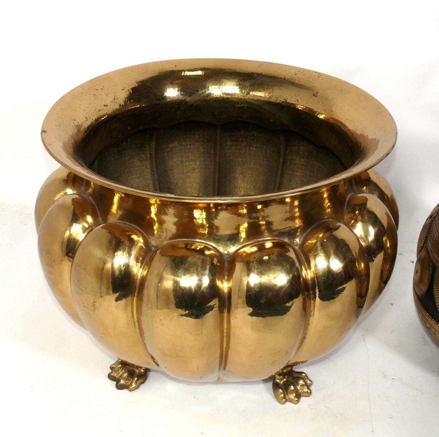 Selection of Brass Planters, circa 1950s, or perhaps much earlier. They are priced at $750 each. 
From left to right, they measure: 15.5