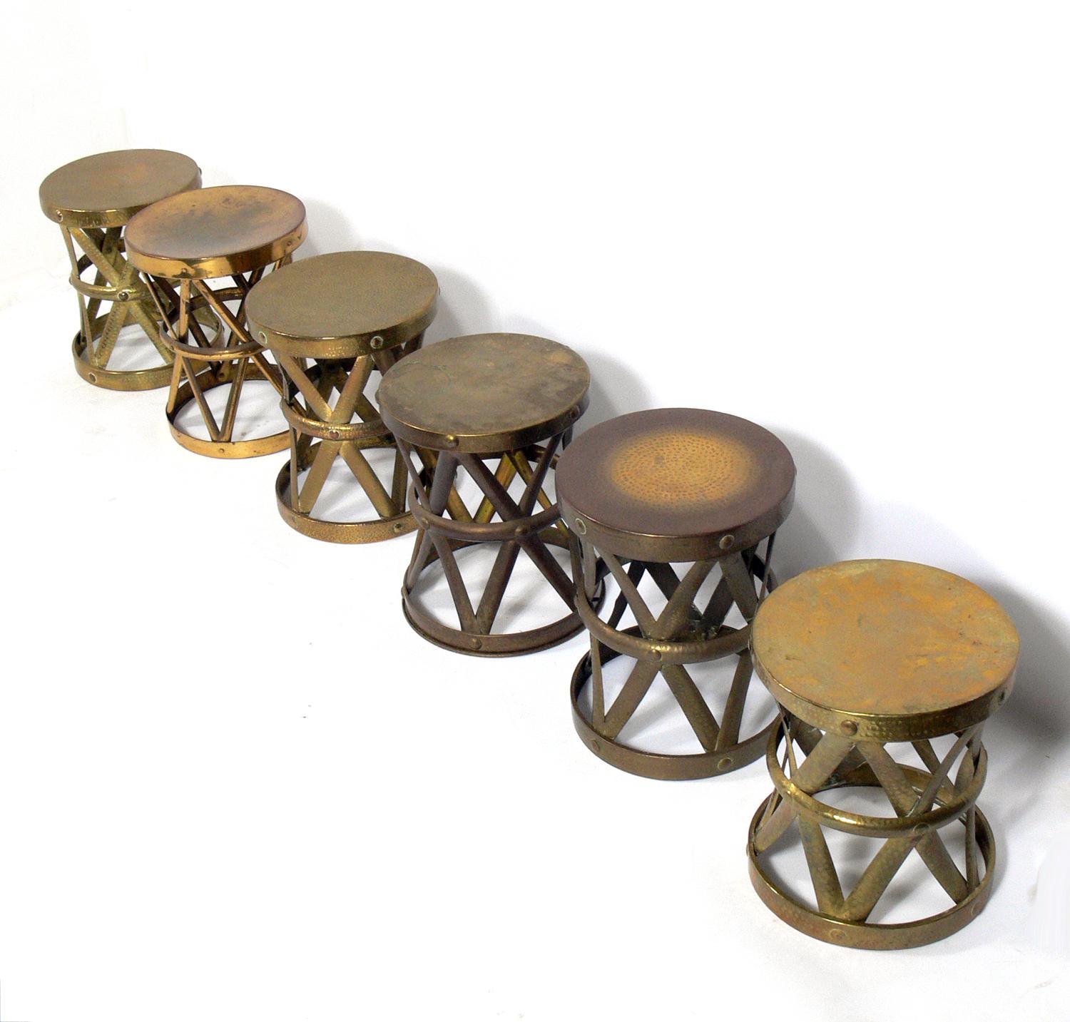 Selection of brass stools, circa 1960s. They are a versatile size and can be used as stools, end or side tables. They all have various patinas and wear. Please see photos. They are priced at $450 each. The tallest stool measures 15.75