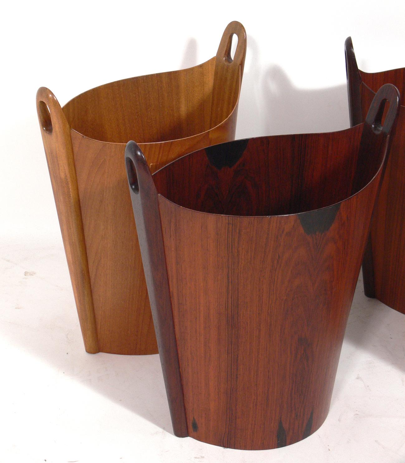 Selection of Danish modern waste cans, designed by Einar Barnes for P.S. Heggen, Norway, circa 1960s. Some examples are constructed of rosewood and the others are teak or beech. Most are signed with branded manufacturer's mark to the interiors [P.S.